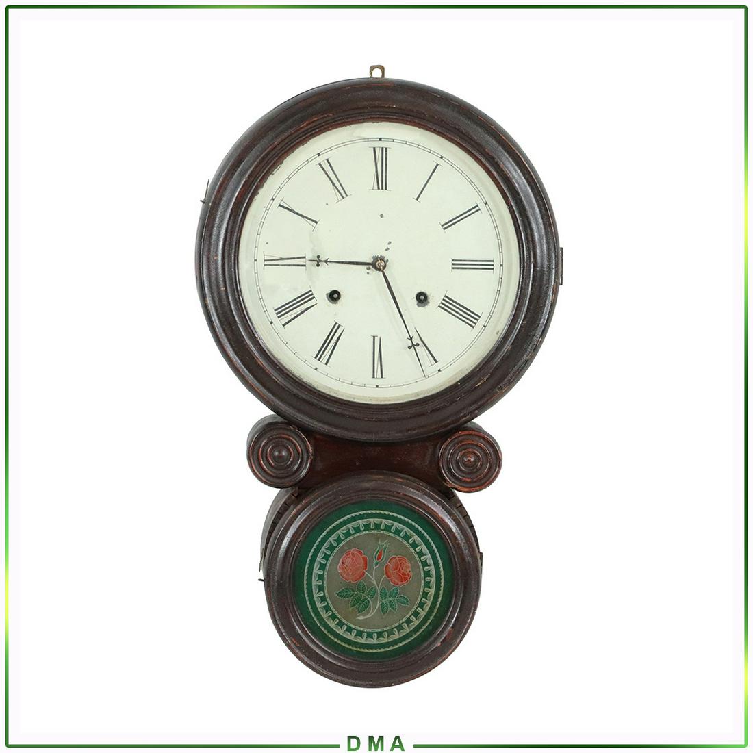 E Ingraham "Ionic" Wall Clock 8 Day Time & Strike: E Ingraham and Co. Bristol Conn. "Ionic" Wall Clock; Eight Day Time and Strike. Has reverse painting Red Roses in bottom section. Has key and pendulum. All original Condition. Size: 21.5h x 13.25w x 3