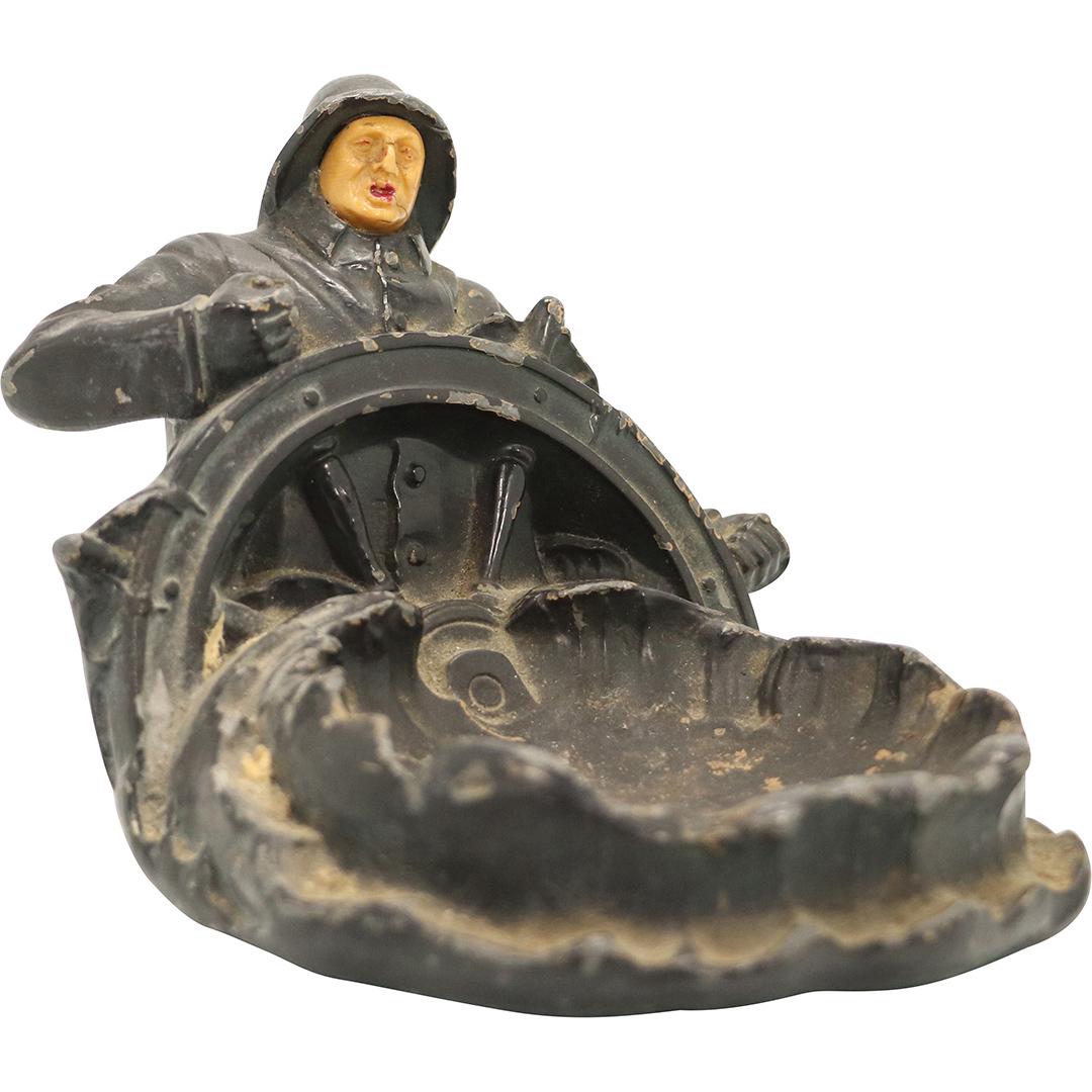 Vintage Cast Metal Seaman Holding Ship's Wheel Ashtray: Vintage Cast Metal Seaman Holding Ship's Wheel Ashtray. Original finish. Size: 4h x 6L