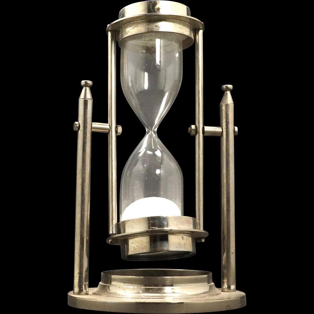 Hourglass in Silver Tone Metal Frame, Compass Top: Hourglass in Silver Tone Metal Frame, Compass Top. Size: 8h x 4.5w