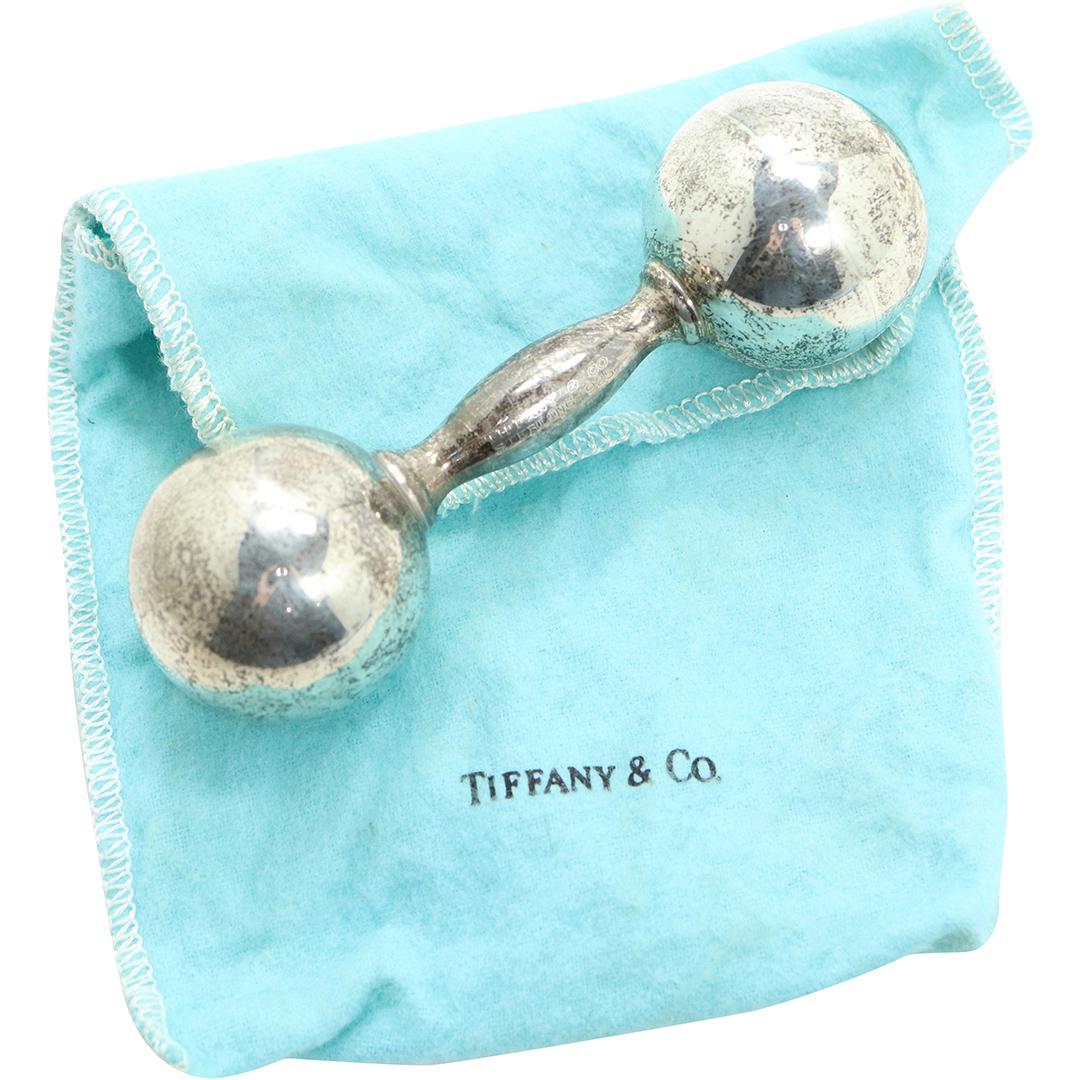TIFFANY & CO .925 Sterling Silver Baby Rattle: TIFFANY & CO .925 Sterling Silver Baby Rattle. Marked: Tiffany & Co. Sterling .925 ; size: 4 1/2 in. x 1/2 in.