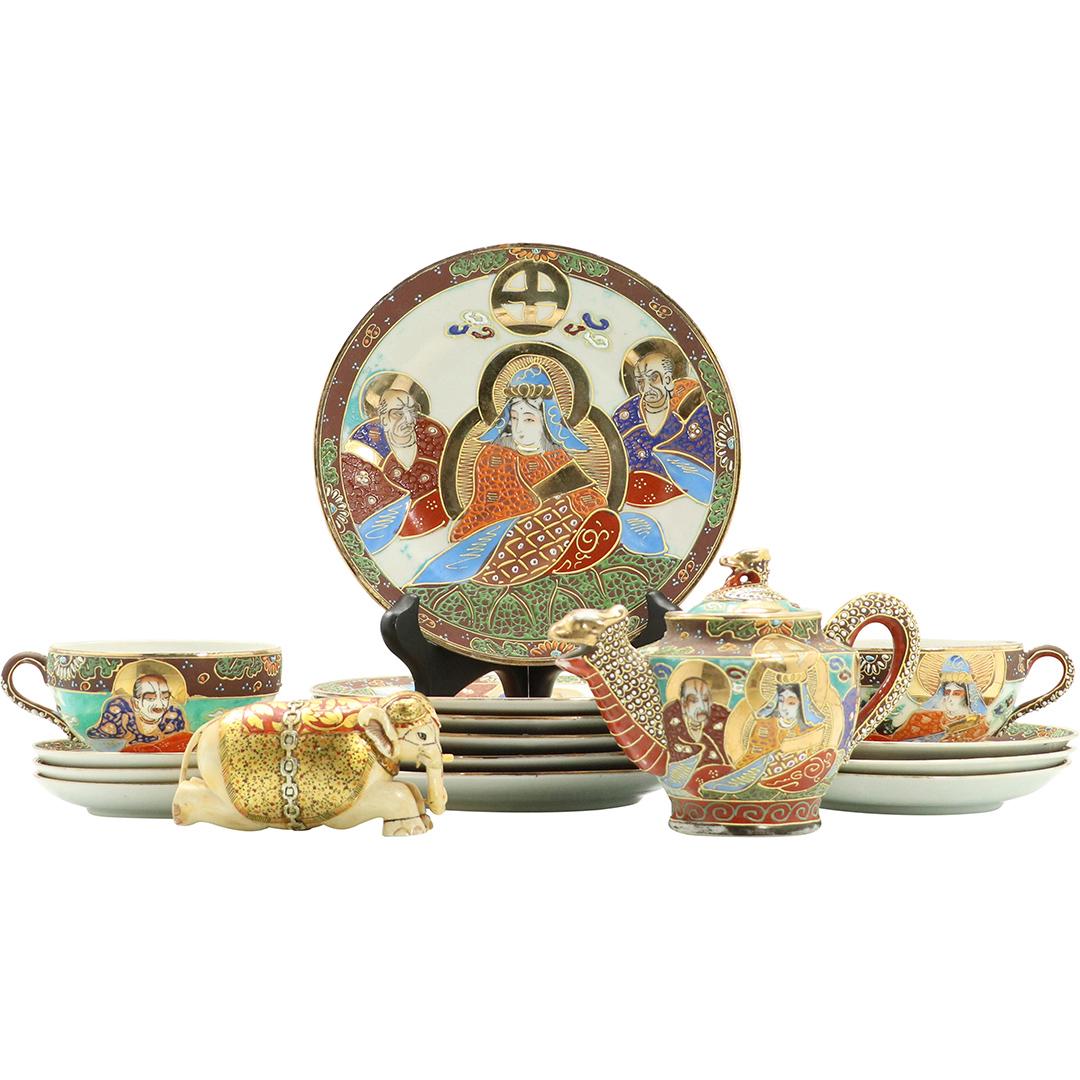 16 Pcs. Japanese Satsuma Tea Set: 16 Pcs. Japanese Satsuma Tea Set. Figures, Dragon, Elephant. Size: (3x)4.25dia saucer, (3x)5.5dia saucer, (6x)7.25dia plates, 2h x 4.5w cups, 4h x 6w pot, 2.25h x 4L elephant