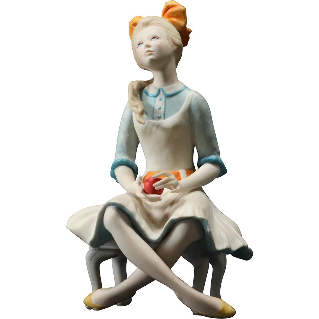 Cybis Porcelain Seated Girl Holding an Apple, Signed: Cybis Porcelain Seated Girl Holding an Apple, Signed. Size: 7.5h x 4.5w