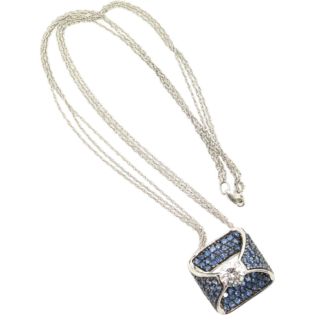 Exquisite .925 Sterling CZ Tanzanite Pendant Necklace: Exquisite .925 Sterling CZ Tanzanite Pendant Necklace. Both marked: .925 ; chain is 3-strand. Size: pendant 1 in. x 1 in. ; chain 18 in. length