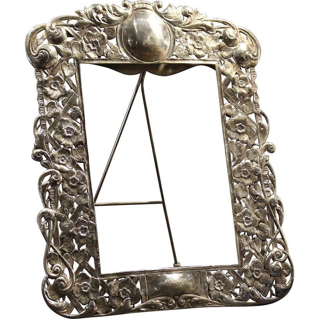 Heavily Repoussed English Silvered Picture Frame: Heavily Repoussed English Silvered Picture Frame. Heavily Repoussed English Silvered Picture Frame. Well chaised, carved and pierced bas relief design with all over floral decoration. Touchmarks on re