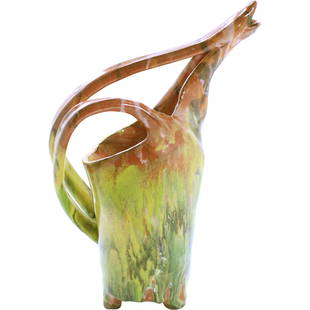 20thC. American Folk Art Pottery Pitcher: 20thC. American Folk Art Pottery Pitcher.Multi-color glazed Folk Art pottery pitcher. Unusual free-form thrown design with snake handle rising to form the spout; 14.5in.H. x 10.5in.W.