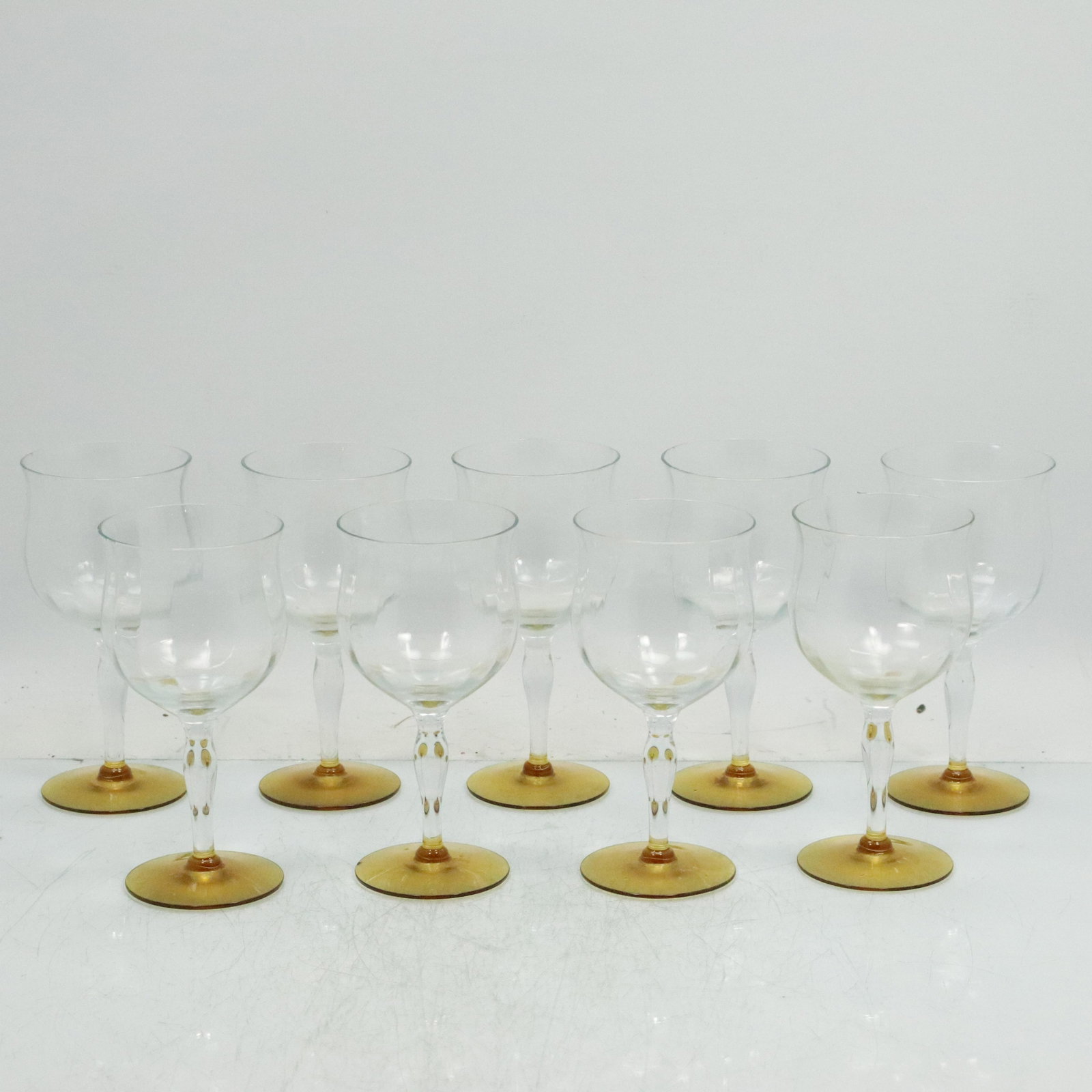 9 Elegant Crystal Wine Stem Glasses with Amber Bases: 9 Elegant Crystal Wine Stem Glasses with Amber Bases. Size: 6.5 h 3.25 w