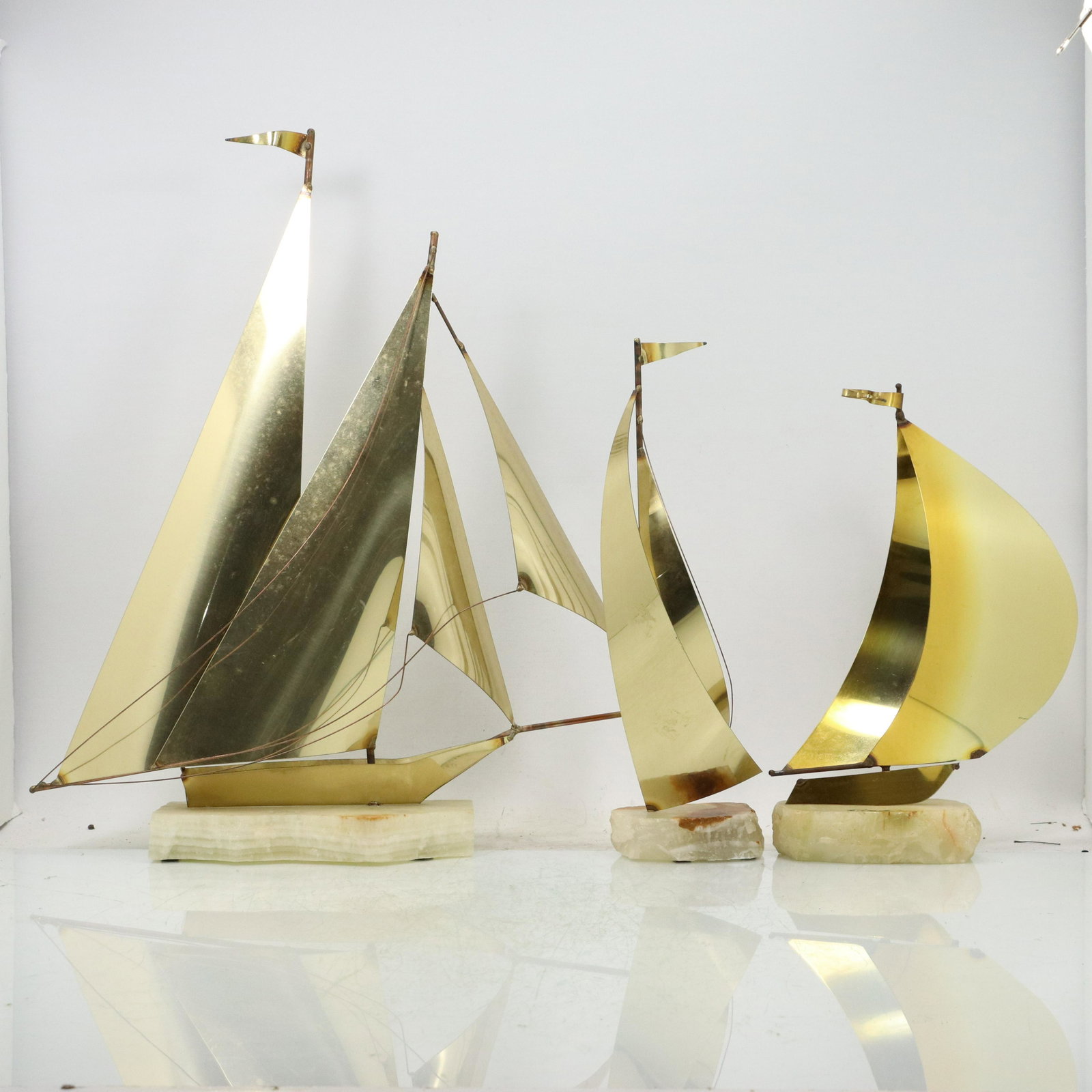 3 Assorted Don Demott Brass & Onyx Sail Ship Sculptures: 3 Assorted Don Demott Brass & Onyx Sail Ship Sculptures. Original patina finish. size: range 11.5 18h and 4 15.5w