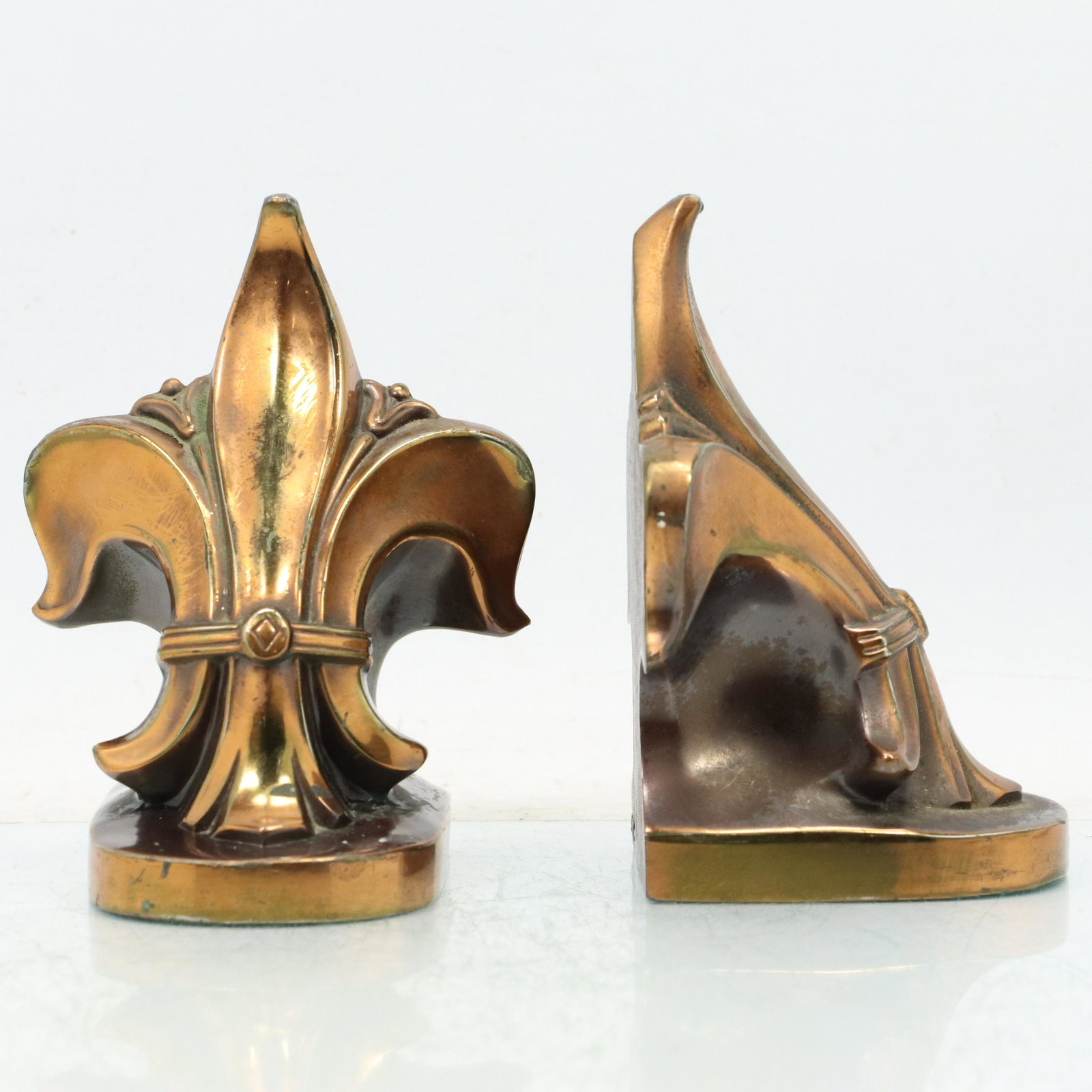Vintage Bronze Finish Metal Cast Fleur Dis Lis Bookends: Vintage Bronze Finish Metal Cast Fleur Dis Lis Bookends. Original patina finish. size: 6h 4.25w
