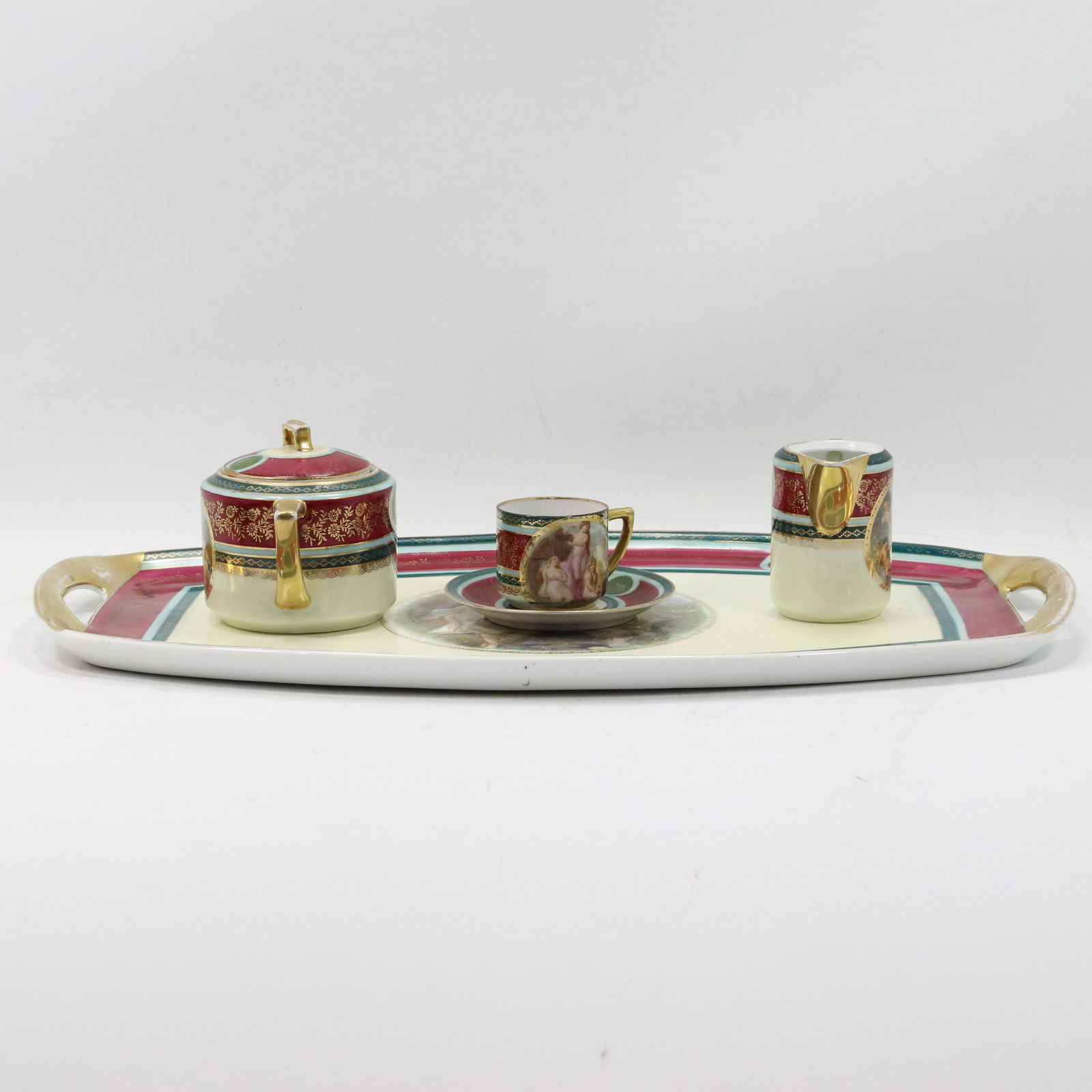 Pirken Hammer FBS Czechoslovakia: Tray S&C, Tea Cup: Pirken Hammer FBS Czechoslovakia: Tray S&C, Tea Cup. Genre scene, Fine porcelain. Size: plate 19l x 10.5w creamer 4h x 3w bowl 4h x 5.5w cup 2h x 4w