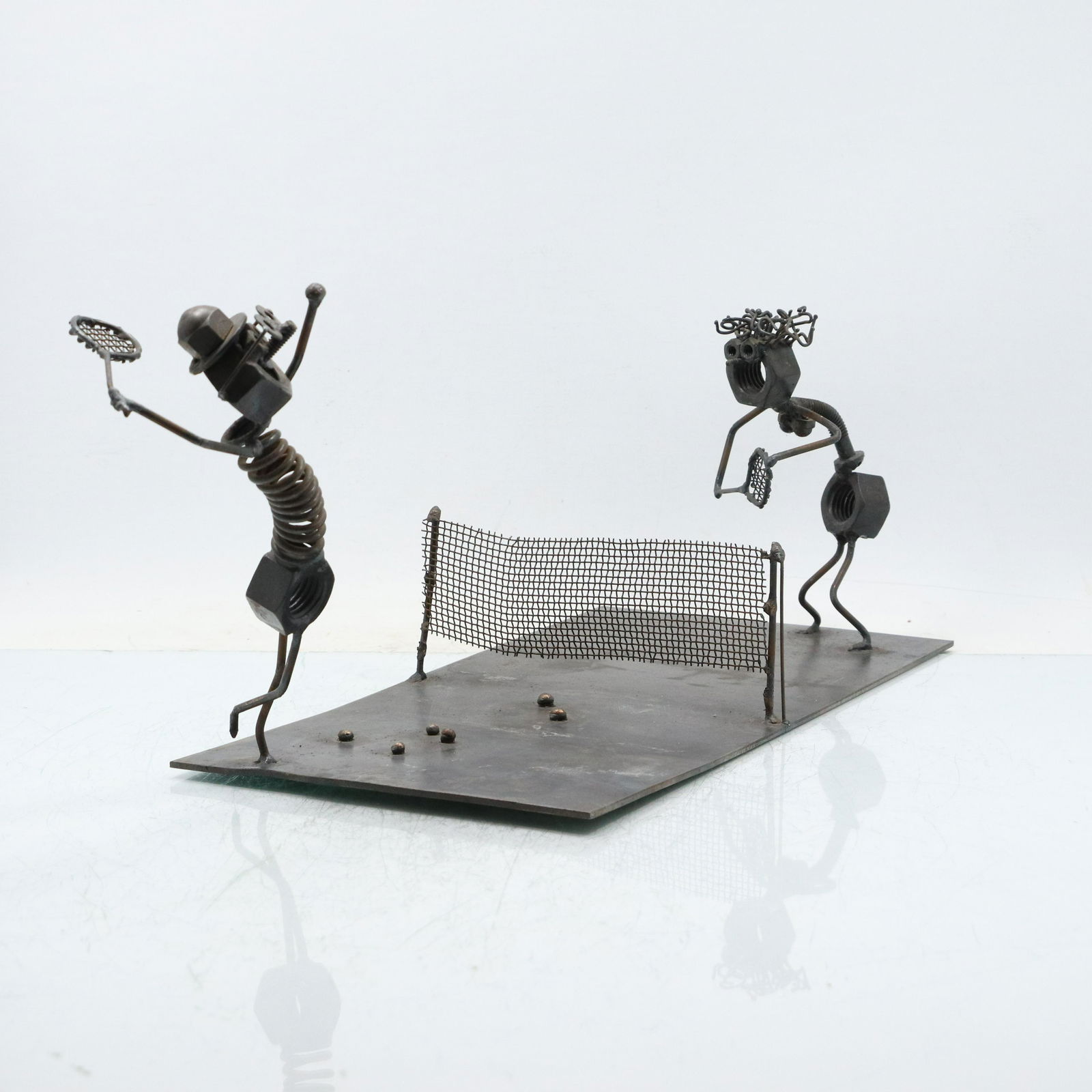 Mid-Century Brutalist Metal Sculpture "Tennis Match": Mid-Century Brutalist Metal Sculpture "Tennis Match". size: 8.5h 20.5w