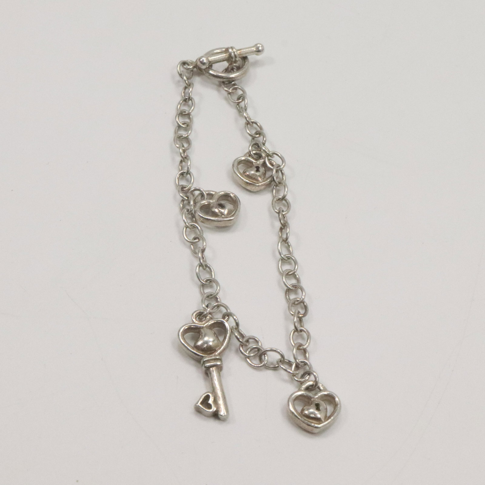 .925 Sterling Silver Charm Bracelet: .925 Sterling Silver Charm Bracelet. Marked: .925 ;Size: 8 in. length