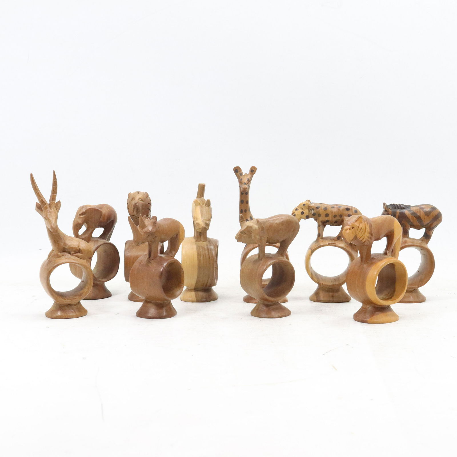 10 Assorted Carved Wood Wild Animal Napkin Ring Holders: 10 Assorted Carved Wood Wild Animal Napkin Ring Holders. Original patina finish. Size: range 4 5.5h and 2.75 3.25w