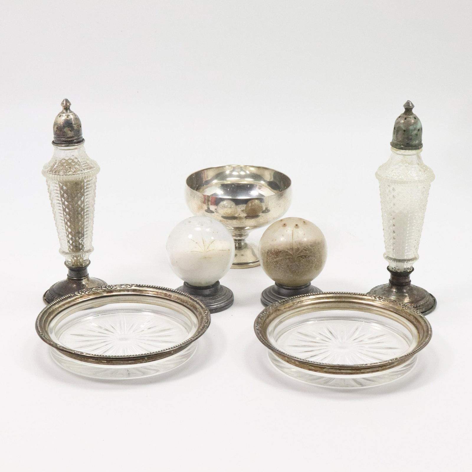 7 Pc. Assorted Sterling Silver S&P, Cup, Wine Coaster: 7 Pc. Assorted Sterling Silver S&P, Cup, Wine Coaster. Sterling Cup 2 3/8 in. x 3 1/8 in. ; Sterling Wine Coaster 4 3/8 in. ; Sterling & Crystal Salt Pepper 5 3/4 in. x 2 in. ; Poole Sterling Ball Cry