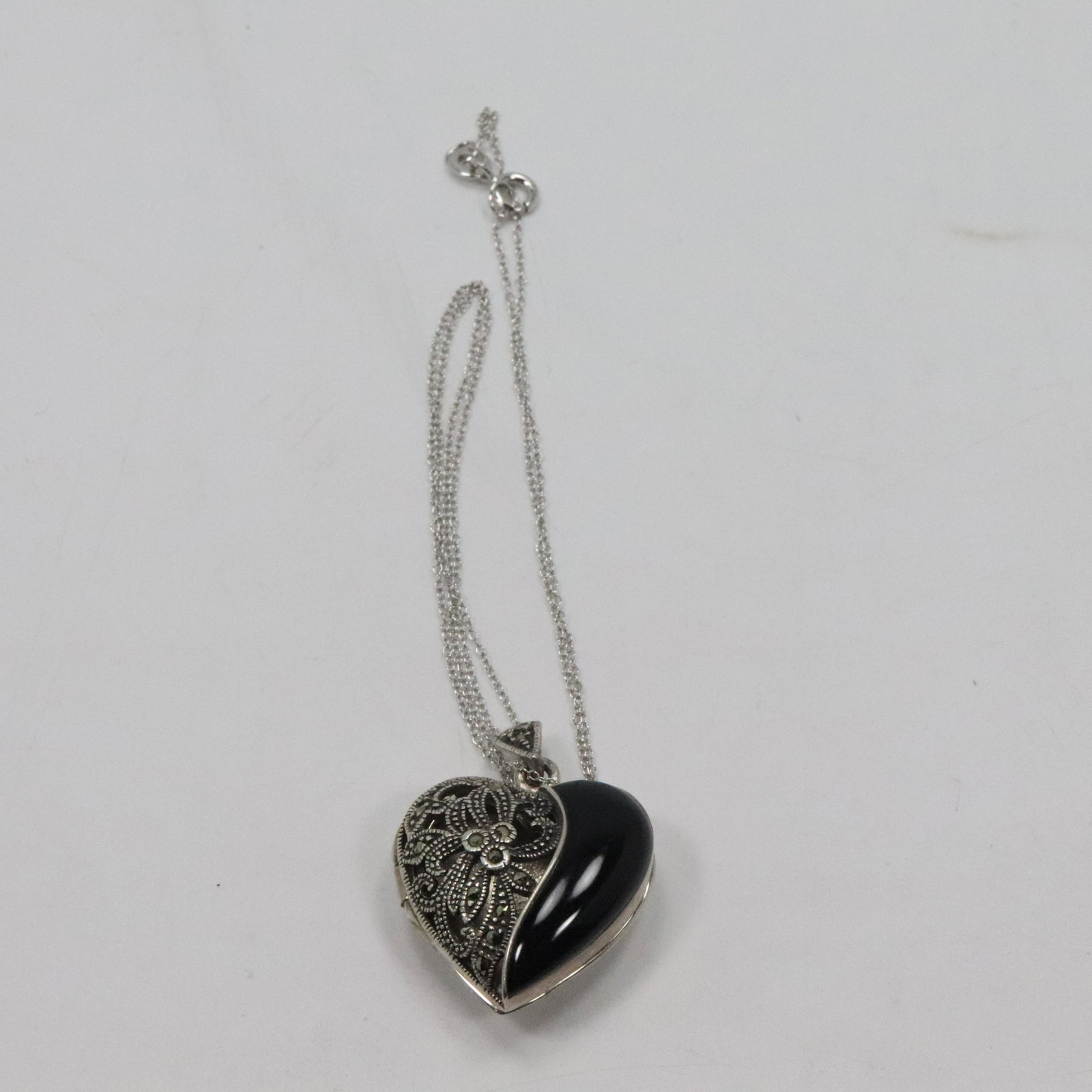 .925 Sterling Black Onyx Marcasites Heart Locket Neckla: .925 Sterling Black Onyx Marcasites Heart Locket Necklace. size: 18 in. x 1 3.8 in. x 1 in. Locket marked FAS