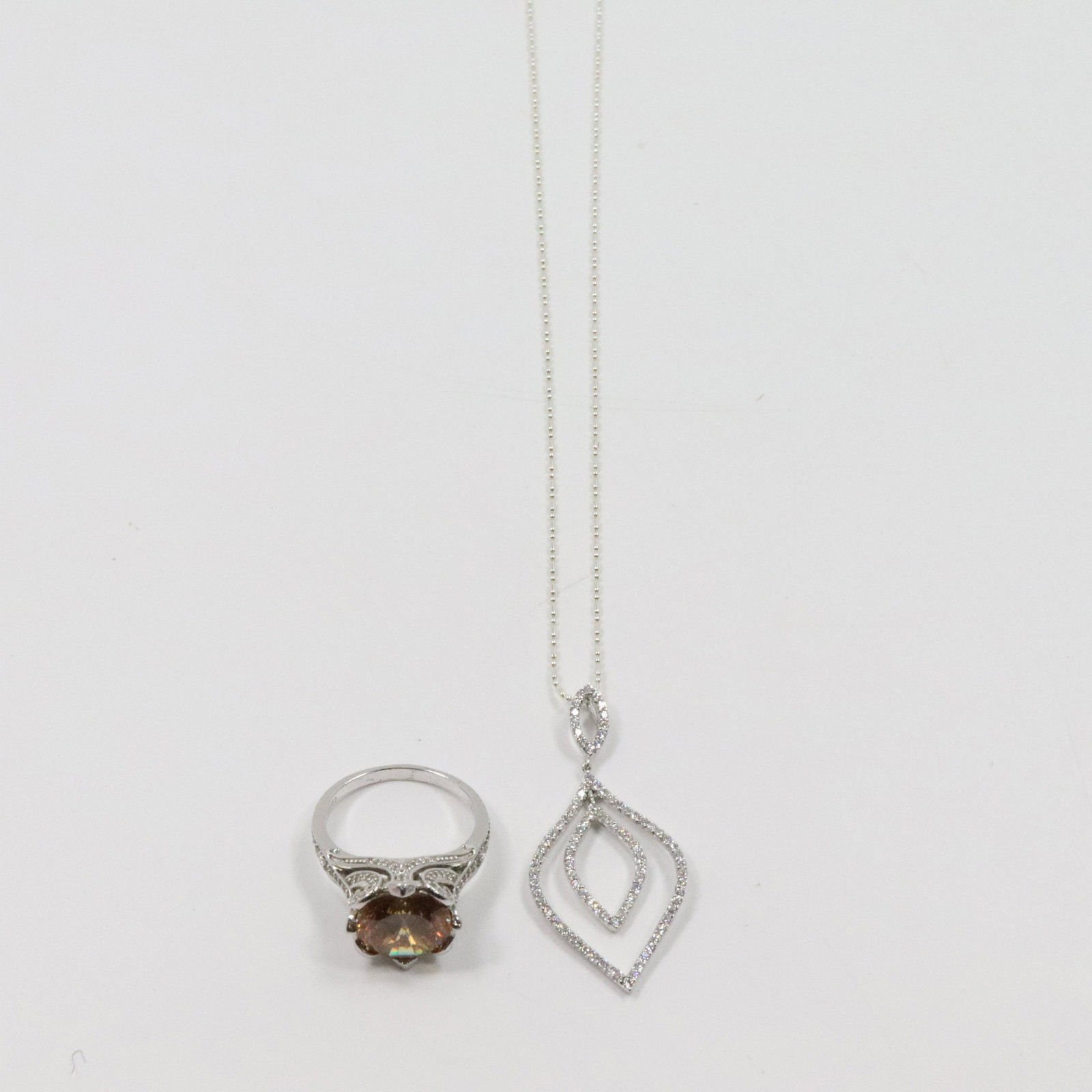 .925 Sterling Modernism CZ Pendant Necklace; Citr. Ring: .925 Sterling Modernism CZ Pendant Necklace 16 in. x 2 in. x 1 7/8 in. ; .925 Sterling Silver Citrine with CZ Cocktail Ring Size 9.5, 7/8 in. x 5/8 in.
