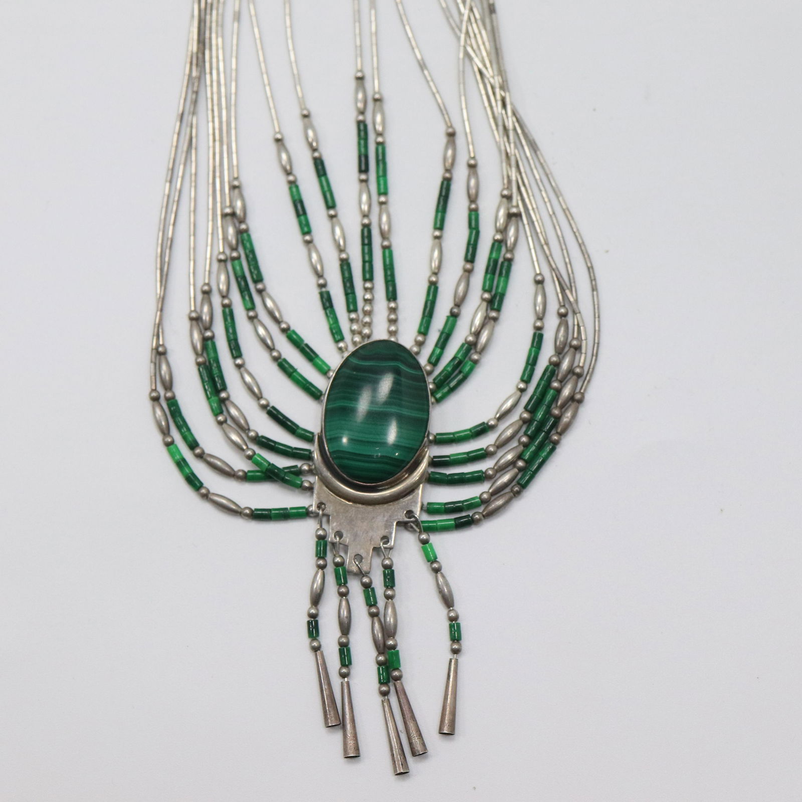 Sterling Silver and Malachite Necklace Native American: Sterling Silver and Malachite Necklace Native American, Marked: Sterling S.E. ; Size: 21 in. x 3 in. Note: Display not included.
