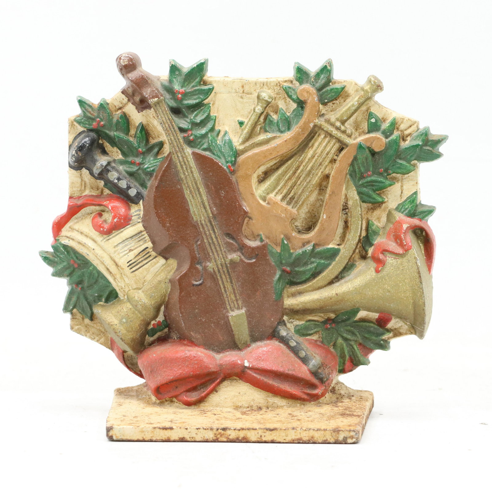 Cast Iron "Array of Musical Instruments" Door Stop: Cast Iron "Array of Musical Instruments" Door Stop. Original paint finish. size: 7h 7.5w