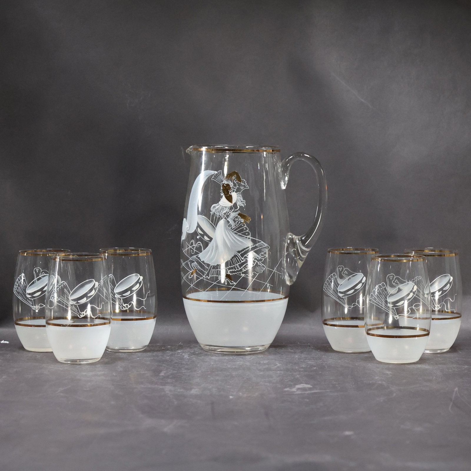 Latin American Dance & Music Glass Pitcher with 7 Cocktail Glasses: Latin American Dance & Music Glass Pitcher with 7 Cocktail Glasses. size: cups (4.5 x 2.5), pitcher (9 x 6)