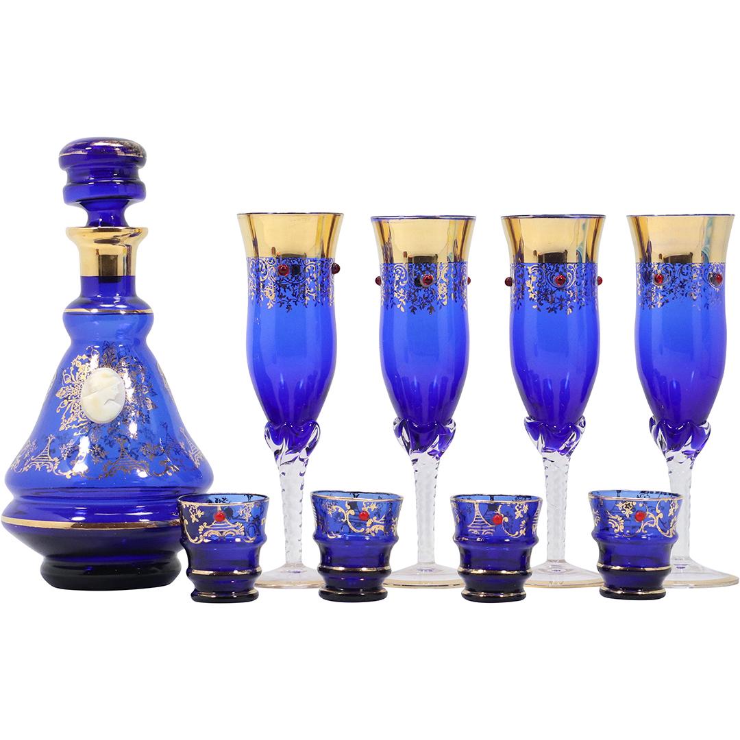 [9] NINE Piece Italian Cobalt Blue & Fancy Gold Glass Decanter and Cocktail Glasses: [9] NINE Piece Italian Cobalt Blue & Fancy Gold Glass Decanter and Cocktail Glasses. size: x4 tall glass 7.75h 2.25w pour 9.5h 4.5w x4 shot glasses 2h 2w