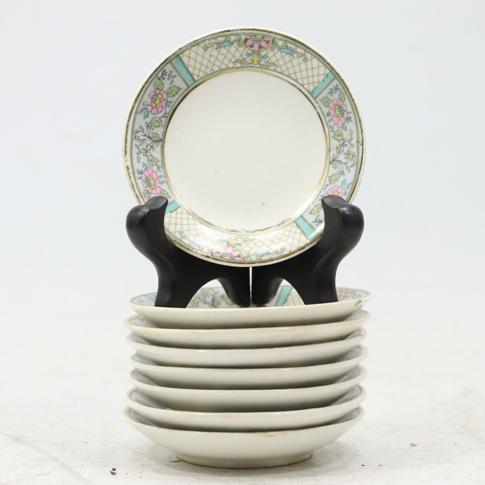 [8] Eight Fine Porcelain Butter Pat Plates with Floral Borders: [8] Eight Fine Porcelain Butter Pat Plates with Floral Borders. size: .5h 3.25w