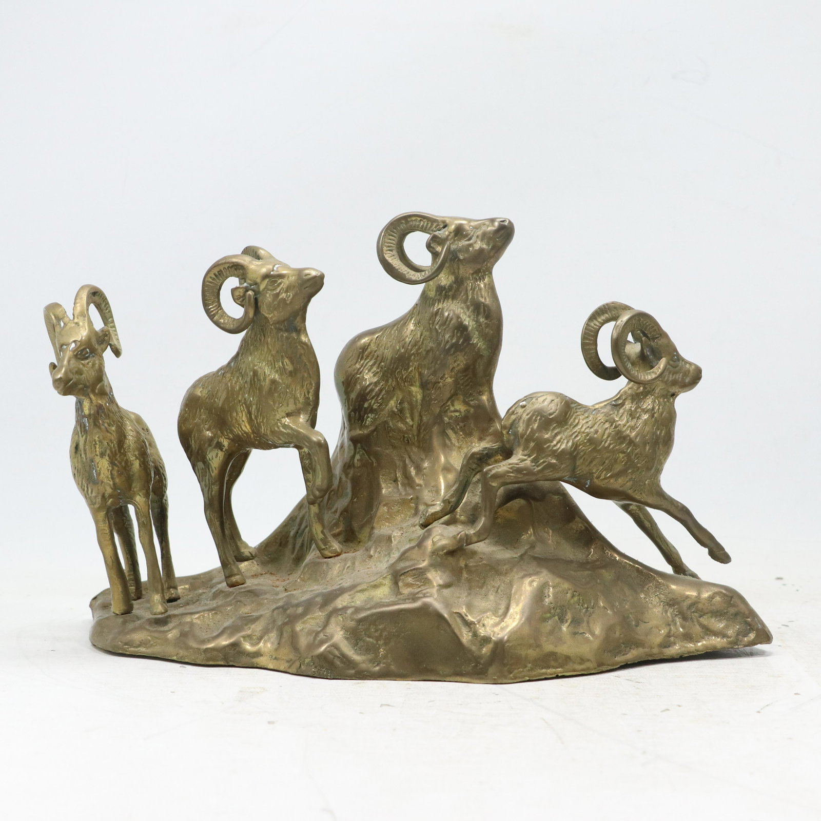 Brass Sculpture Herd of Mountain Goats Rams on a Hill Mound: Brass Sculpture Herd of Mountain Goats Rams on a Hill Mound. Original patina finish. size: 9.25h 14w