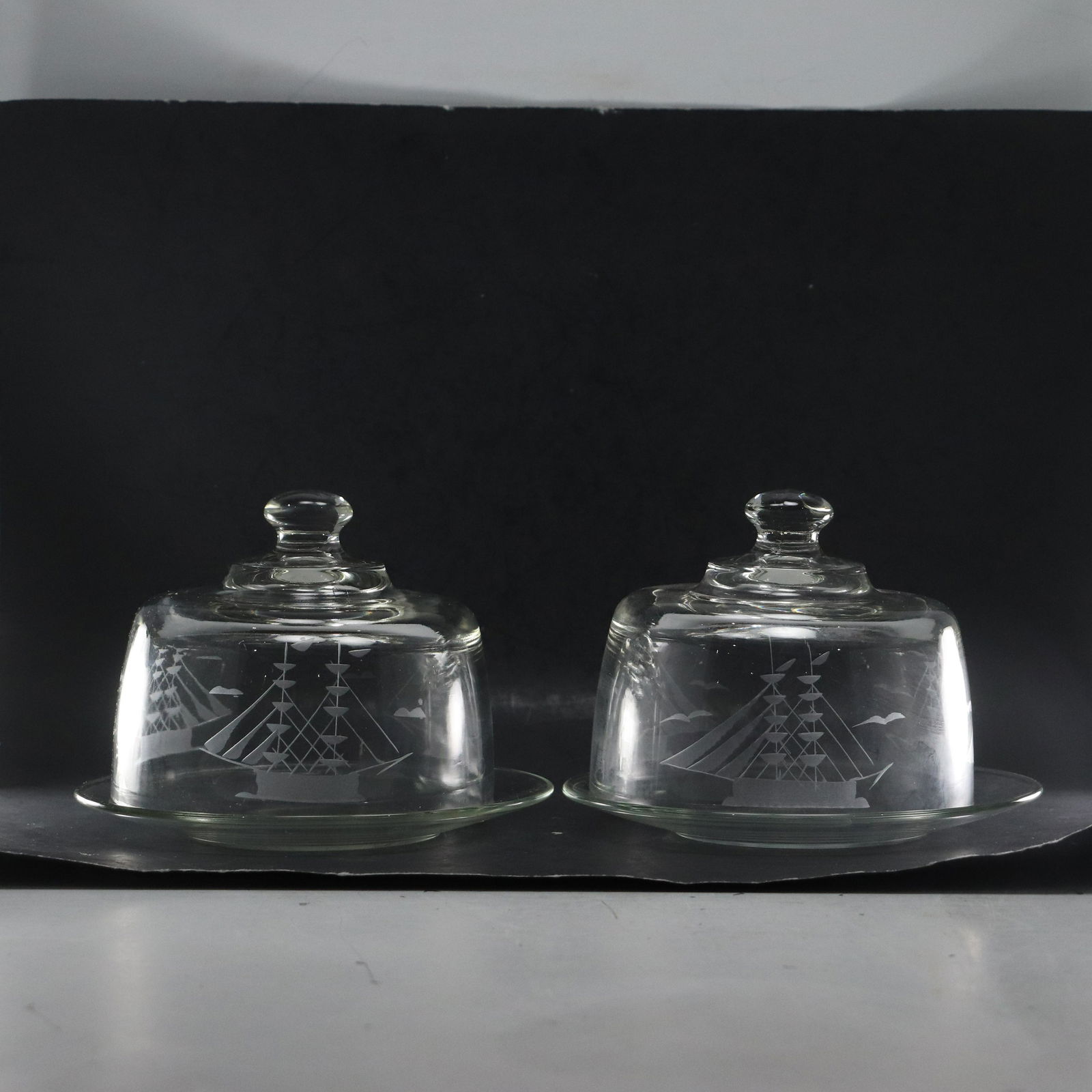 [2] Etched Tall Shipes Crystal Glass Butter and Cheese Covered Plates: [2] Etched Tall Shipes Crystal Glass Butter and Cheese Covered Plates size: x2 plates .75h 8w x2 covers 5.5h 6.5w