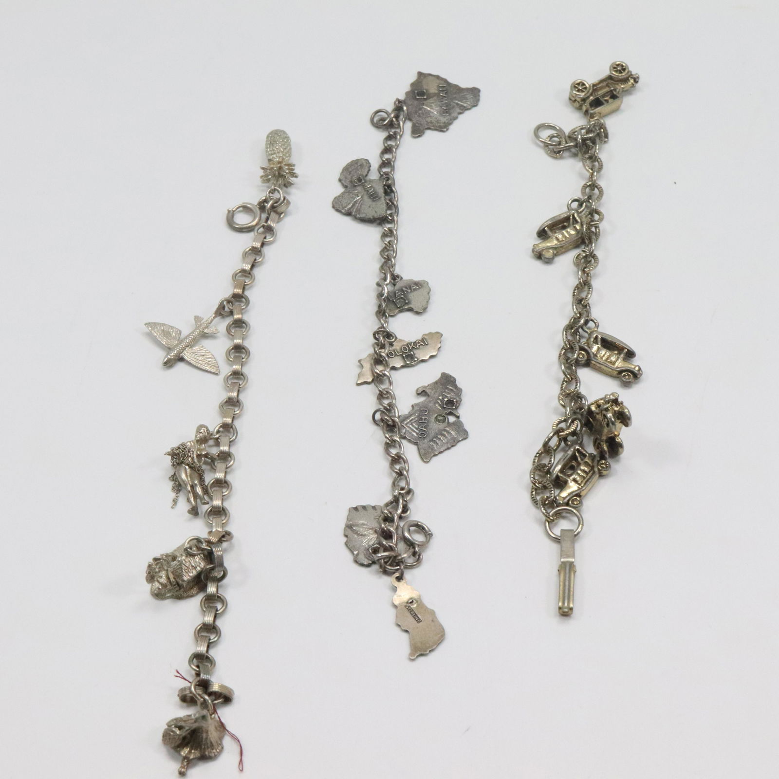 [3] Three Assorted .925 Sterling Silver Charm Bracelets [5 charms, 7 charms, 5 charms] (1 of 7)