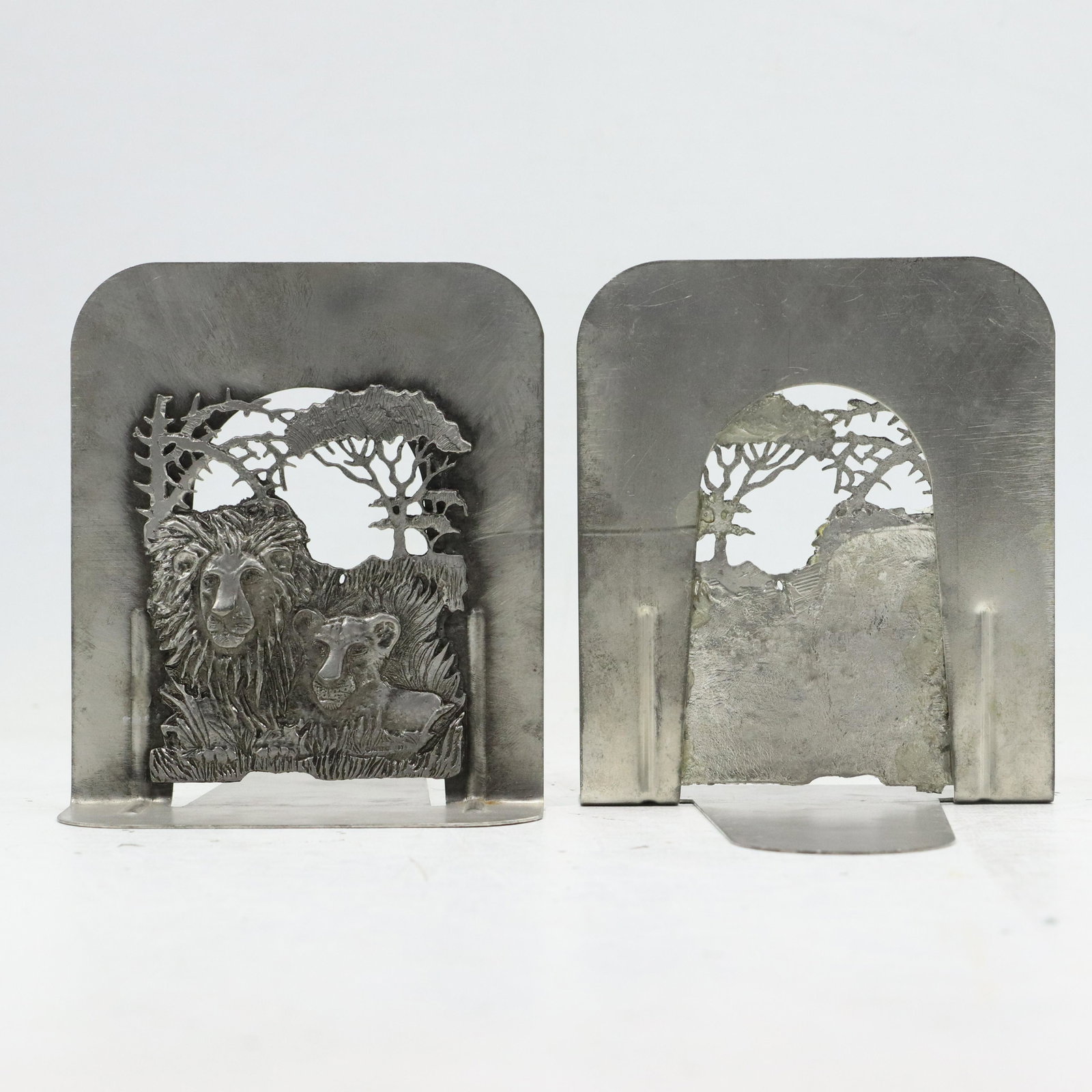 Arts & Crafts Metal Ware Art LION AND CUB IN NATURAL SETTING Bookends: Arts & Crafts Metal Ware Art LION AND CUB IN NATURAL SETTING Bookends. Original patina finish. size: 5.5h 4.75w
