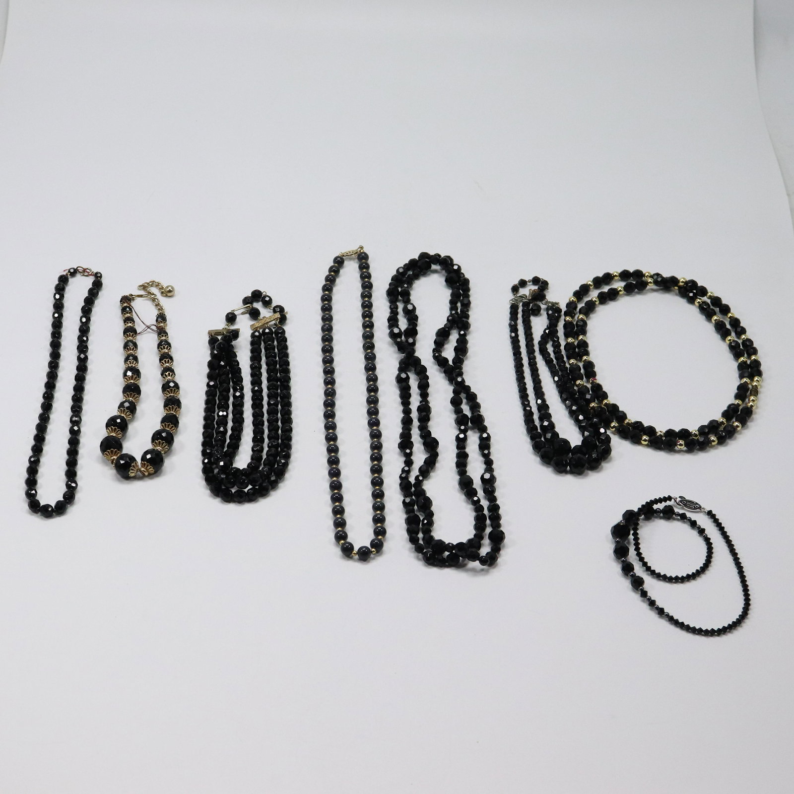 [8] Black Glass Necklaces including 3-Strand, Hematite, Sizes Range 45 in. to 16 in.: [8] Black Glass Necklaces including 3-Strand, Hematite, Sizes Range 45 in. to 16 in.