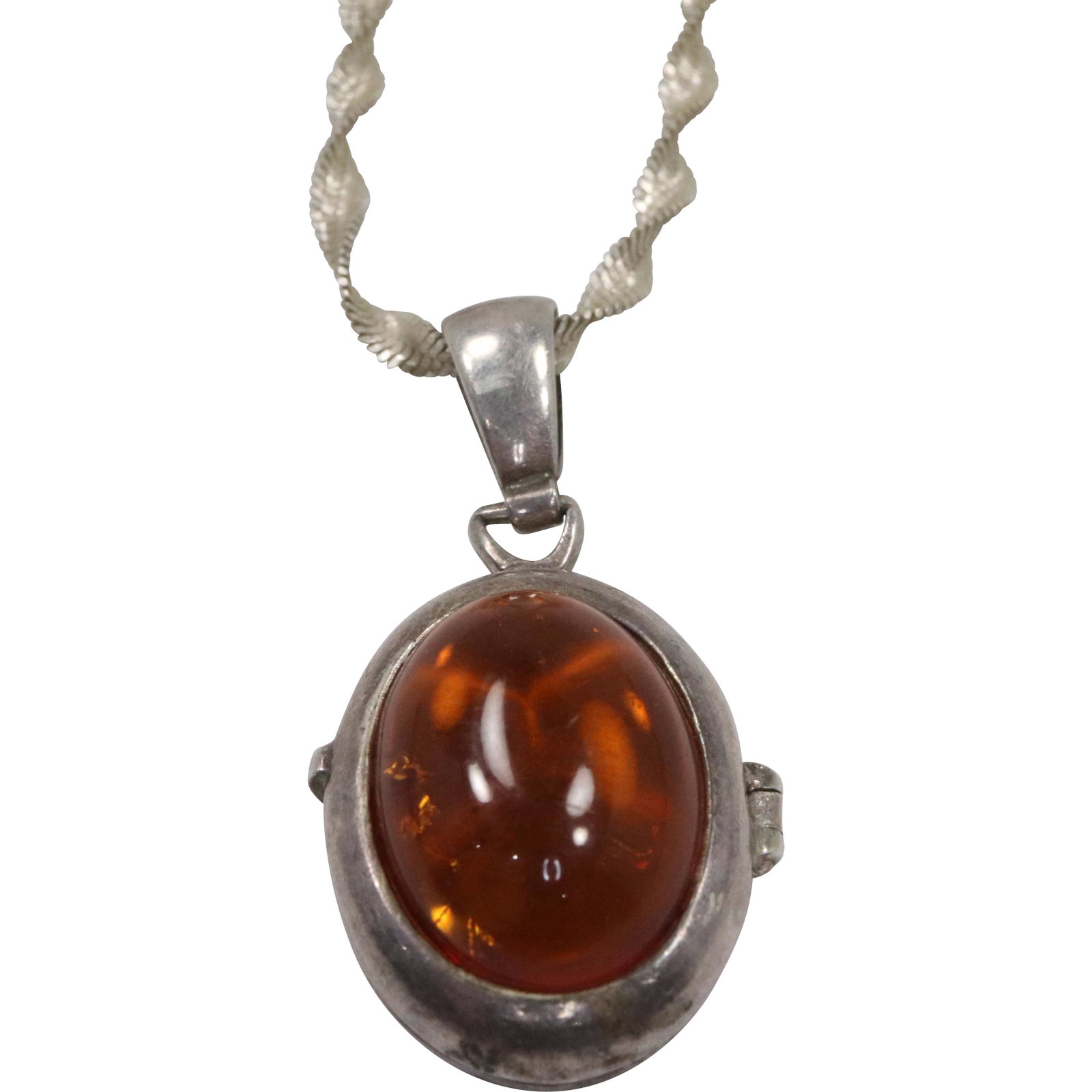Sterling Silver with Amber Locket Pendant on 16 in, .925 Sterling Byzantine Chain: Sterling Silver with Amber Locket Pendant 1 5/8 in. x 7/8 in. on 16 in, .925 Sterling Byzantine Chain