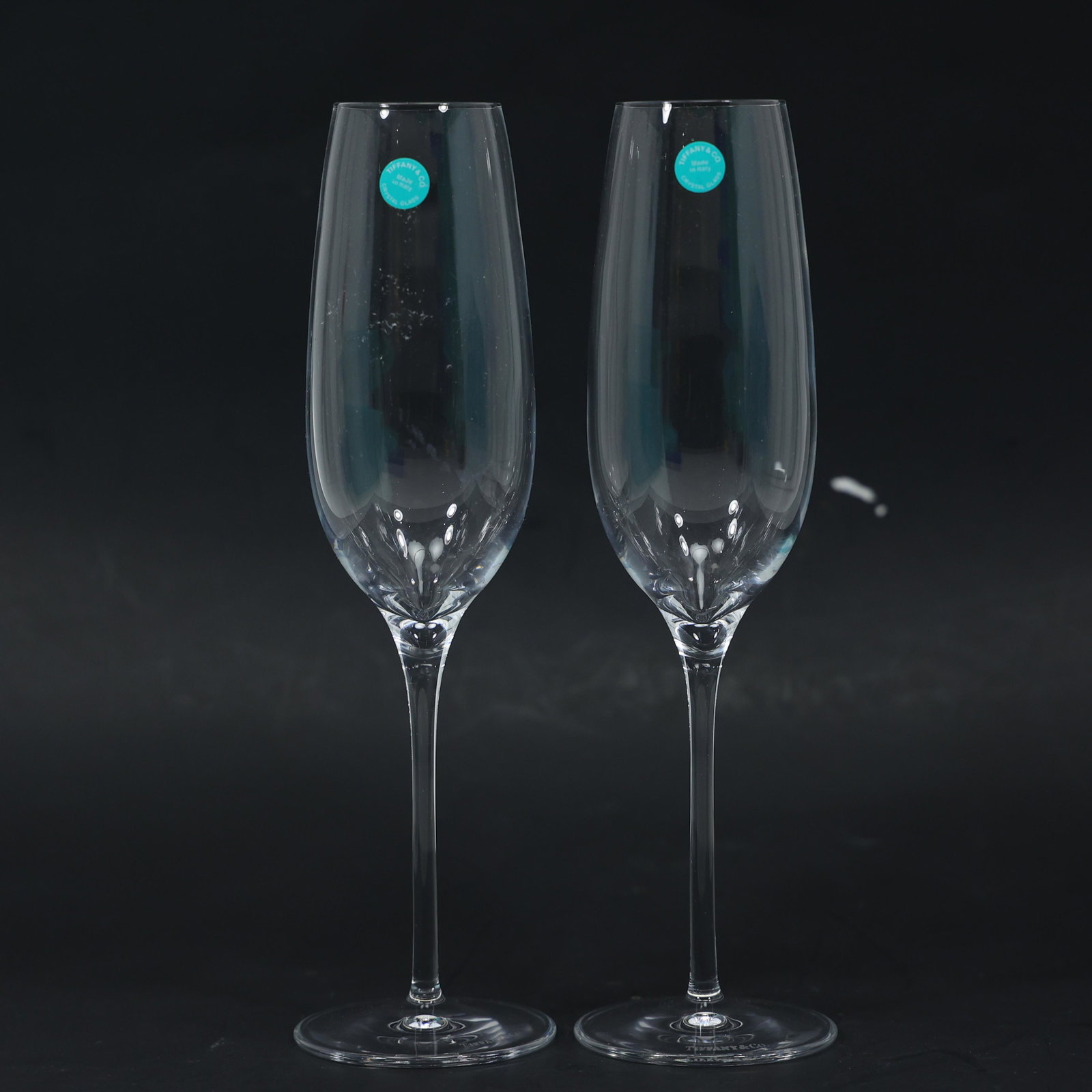 TIFFANY & CO His and Hers Crystal Glass Flute Champagne Toasting Glasses: TIFFANY & CO His and Hers Crystal Glass Flute Champagne Toasting Glasses. Signed and original label. size:x2 glasses 9.75h 2.75w box 6.75h 13w