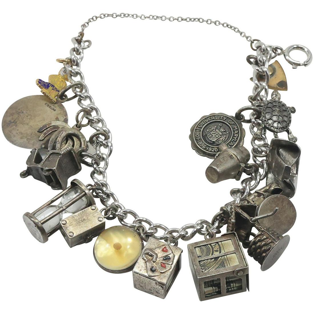 Sterling Silver Charm Bracelet with 17 Charms [12 Charms are Sterling]: Sterling Silver Charm Bracelet with 17 Charms [12 Charms are Sterling]. Size: 7 in. x 1/4 in.