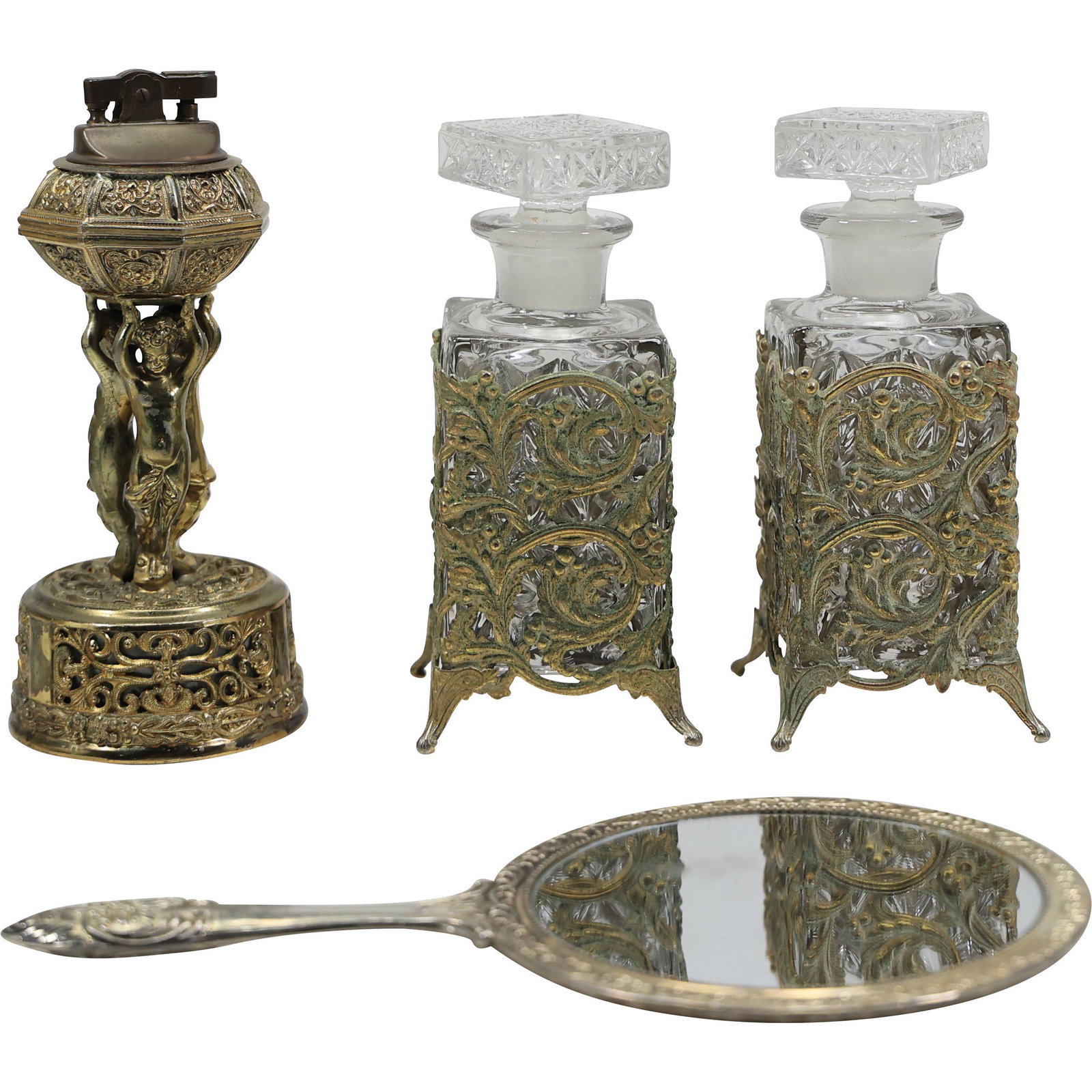 4 Pc. Circa 1940s Fancy Gold Tone Metal 2 Cologne Bottles; Cigarette Lighter & Hand Mirror: 4 Pc. Circa 1940s Fancy Gold Tone Metal 2 Cologne Bottles; Cigarette Lighter & Hand Mirror. size: mirror 10h 6w lighter 7h 3w x2 glass bottles 7h 3w