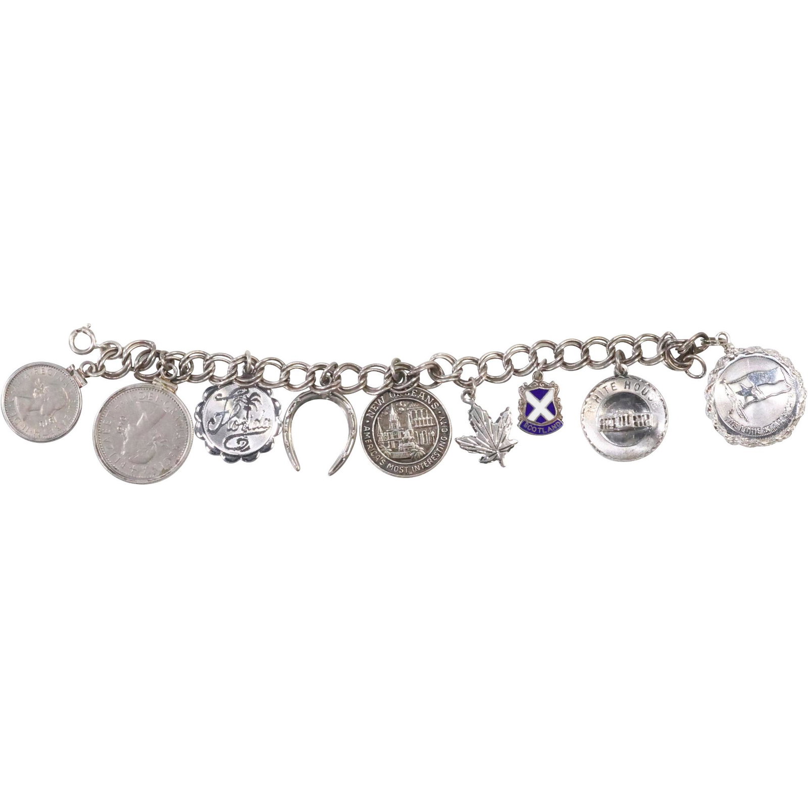 Sterling Silver Charm Bracelet with 9 Sterling Charms 7 in. x 1 in. to 1/2 in.: Sterling Silver Charm Bracelet with 9 Sterling Charms 7 in. x 1 in. to 1/2 in. ; Charms include White House, Coins, Leaf