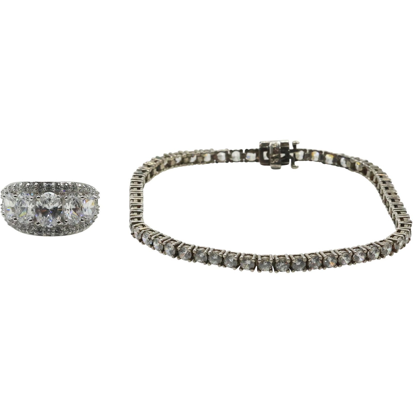 .925 Sterling Silver CZ Band Ring Size 7 & .925 Sterling Silver CZ Tennis Bracelet: .925 Sterling Silver CZ Band Ring Size 7 ; 7/8 in. x 1/2 in. & .925 Sterling Silver CZ Tennis Bracelet 7 1/2 in. x 1/8 in. .