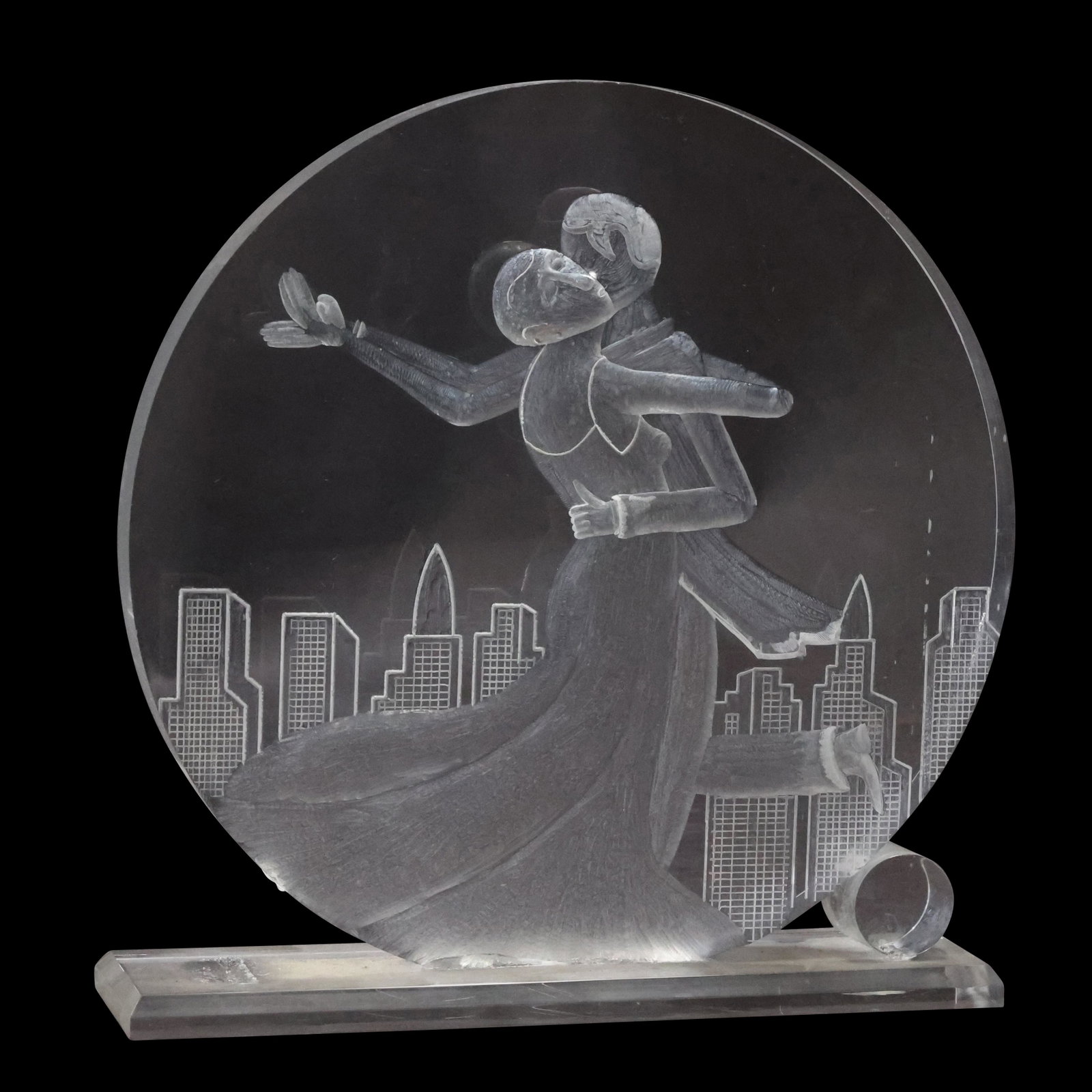 Signed S Mann, Lucite Sculpture Dancing Couple Cityscape Background: Signed S Mann, Lucite Sculpture Dancing Couple Cityscape Background. size: 7.75 x 7.5 x 2