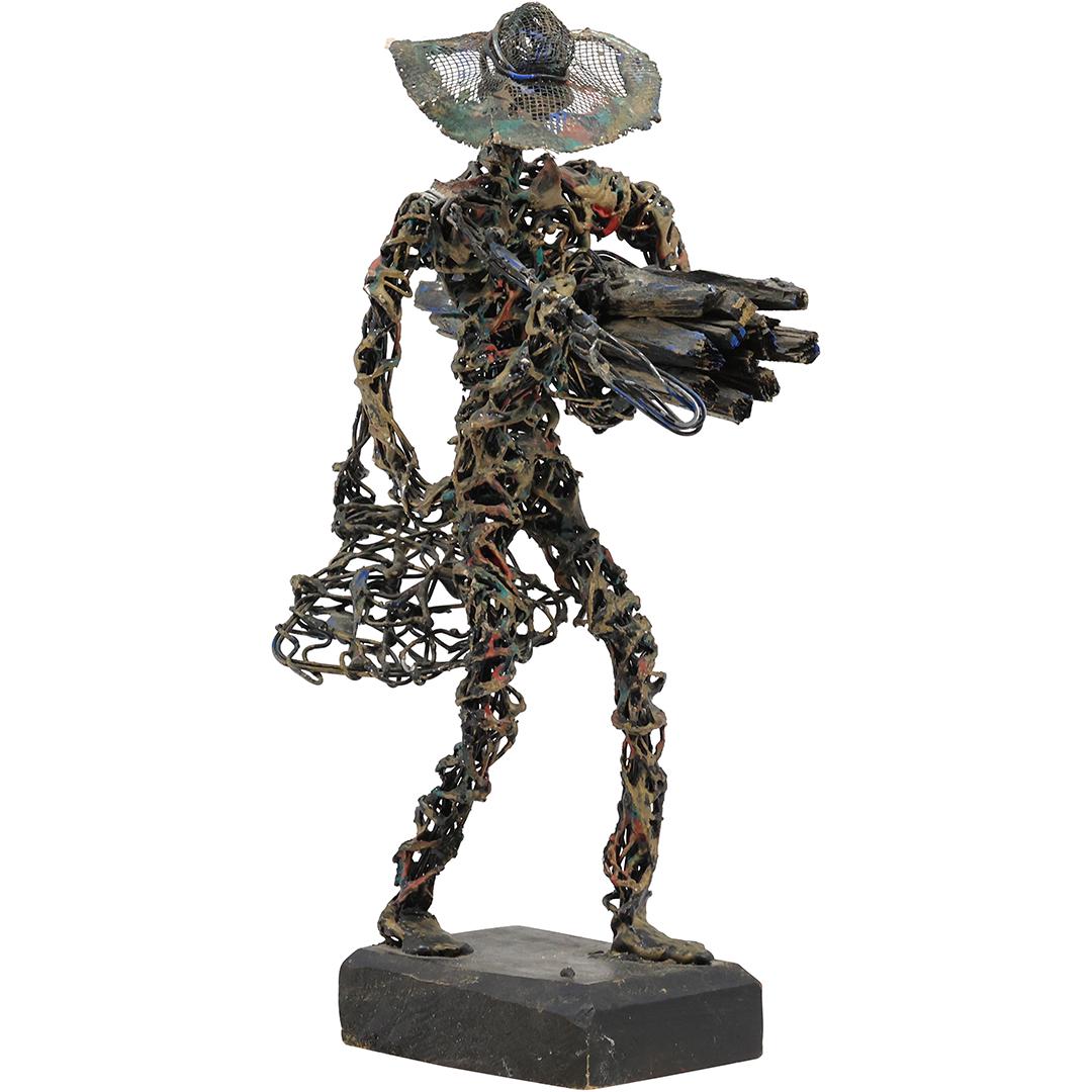 C Serraty, Dominican Republic, Figure Carrying Wood Wrapped and Twisted Metal Sculpture: C Serraty, Dominican Republic, Figure Carrying Wood Wrapped and Twisted Metal Sculpture. Signed on Base. size: h 12 inches L 5 inches
