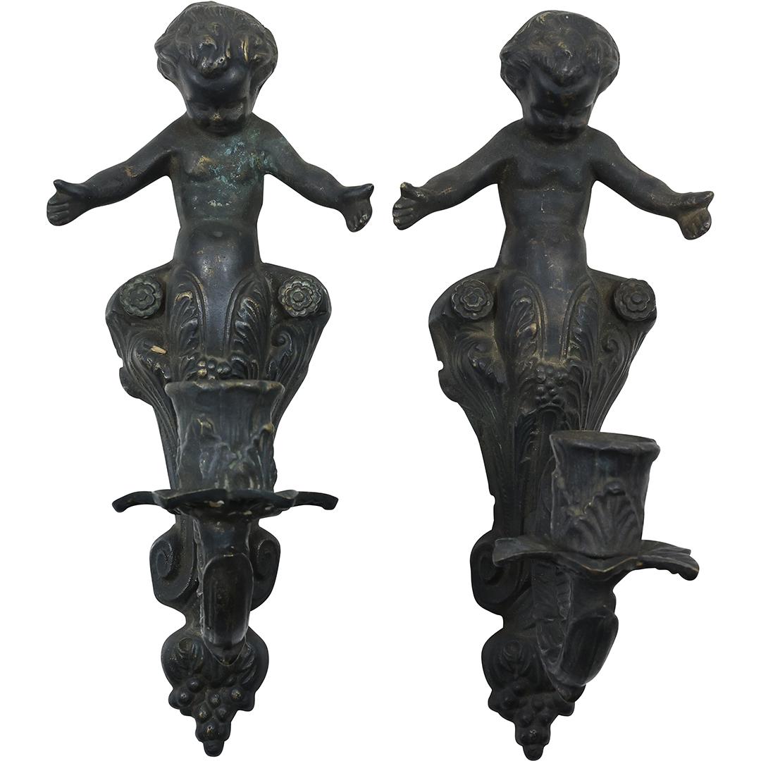 Heavy Bronze Casting Allegorical Cheubs Wall Candle Sconces 13 inches length: Heavy Bronze Casting Allegorical Cheubs Wall Candle Sconces 13 inches length. Original dark patina finish. size: 6.75 in. x 13 in. x 4 in. THIS AUCTION HAS SPECIAL PICK UP DATES SPECIAL PICK UP DATES 