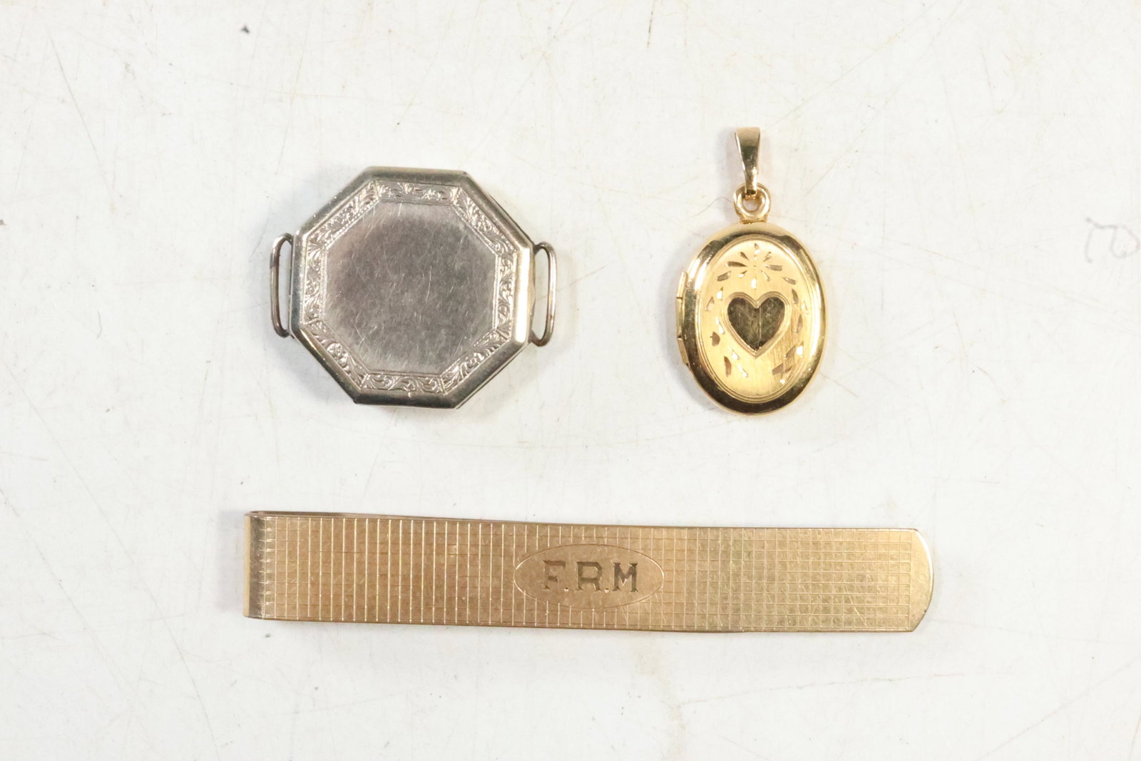 [3] Tie Bar 12K GF, Locket, and 14K GF White Gold Case: [3] Tie Bar 12K GF 3 in. x 1/2 in. , Locket 1 1/4 in. x 5/8 in., and 14K GF White Gold Case 1 in. diameter