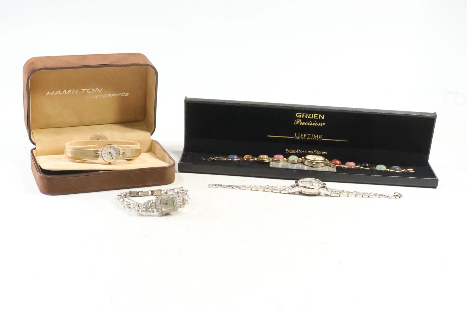 [4] Ladies Wristwatches: Pennino 10K RGP with CZ; Hamilton 10K RGP with Diamonds; Crawford: [4] Ladies Wristwatches: Pennino 10K RGP with CZ; Hamilton 10K RGP with Diamonds new in box; Crawford 17 jewels Rhinestones unbreakable main spring; Gruen Swiss Scarab