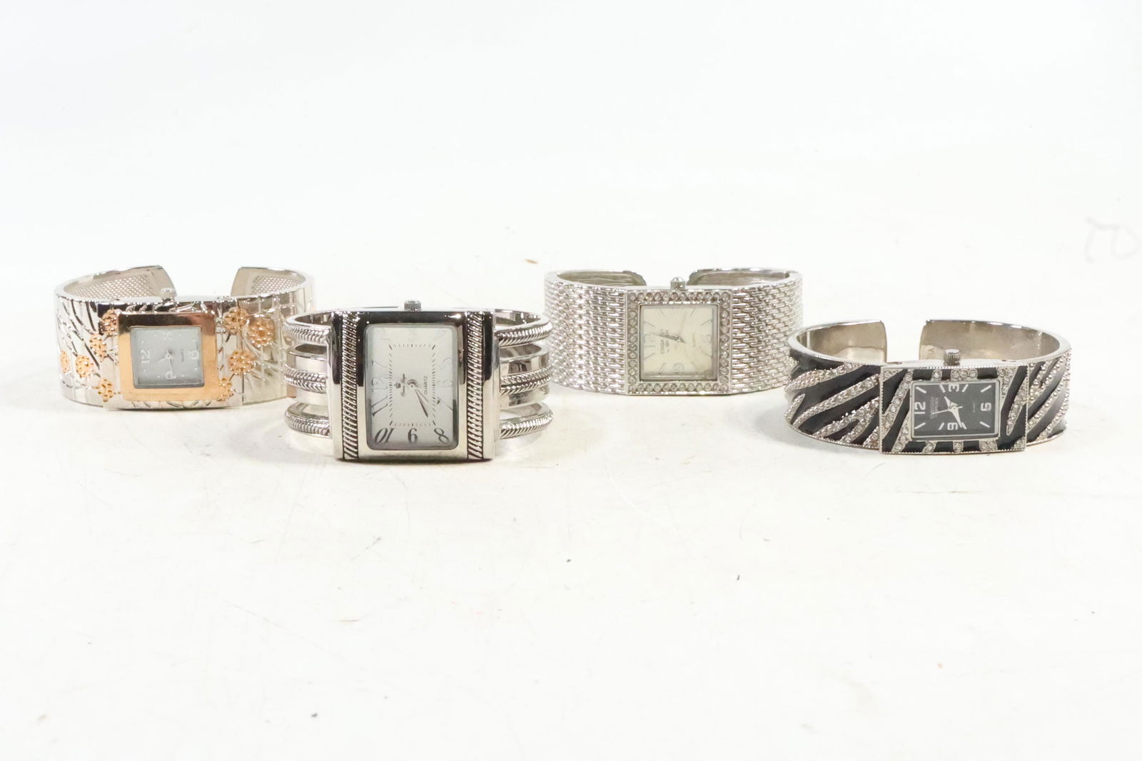 [4] Assorted Cuff Wristwatches: SLE Silvertone Copper Accents; Embassy by Gruen Zebra Print; (1 of 18)
