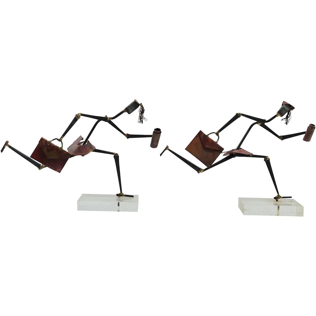 Signed PATTI KAHN Sculpture of 2 Iron Metal Businessmen Running on Lucite Base 8 inches length: Signed PATTI KAHN Sculpture of 2 Iron Metal Businessmen Running on Lucite Base 8 inches length. size: 5.5 in. x 8 in.