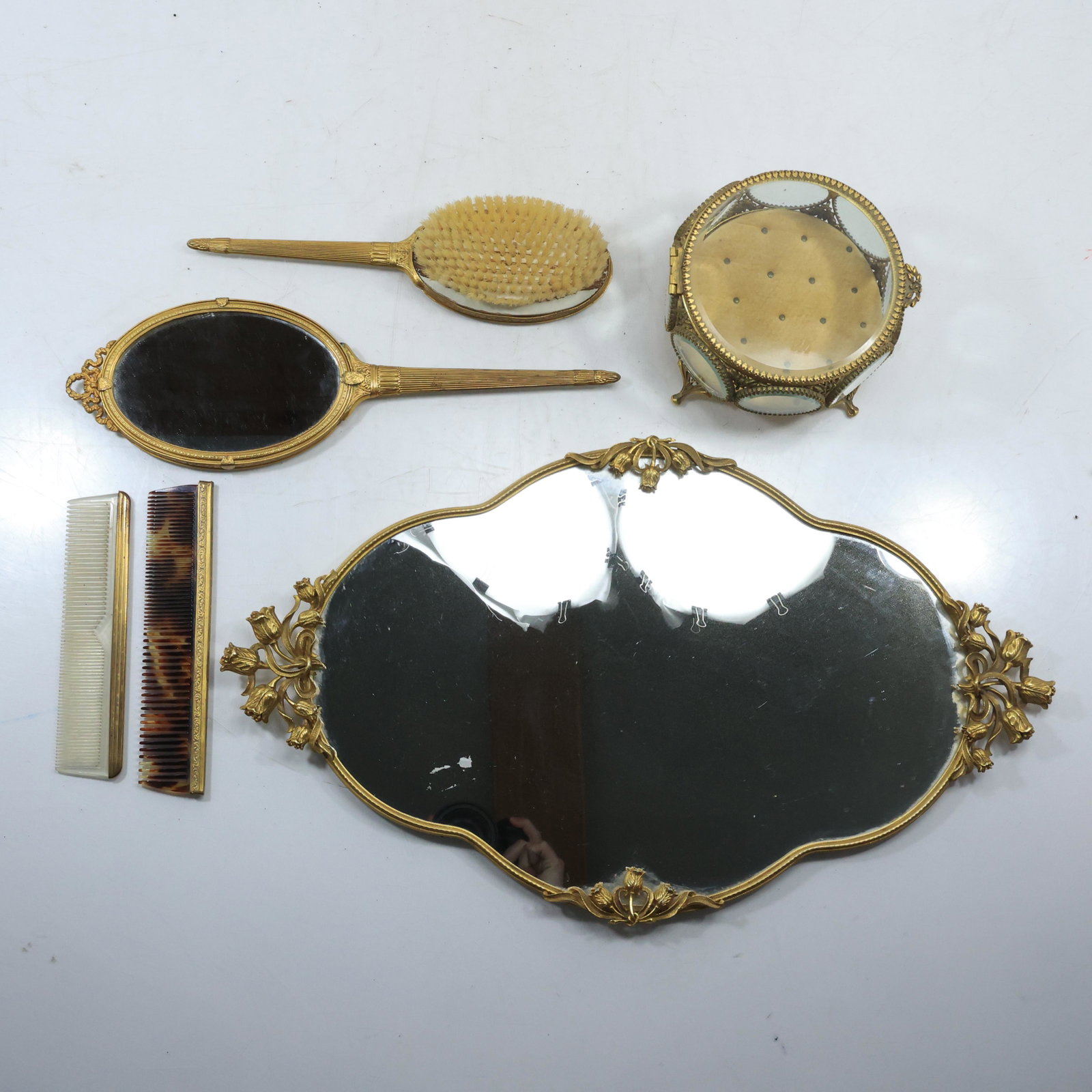 6 Piece 1940s Vanity Accessories Brush, Combs, Vitrine Box and Mirrored Dresser Tray: 6 Piece 1940s Vanity Accessories Brush, Combs, Vitrine Box and Mirrored Dresser Tray size: 3.5x6 (box), 1x10 (wall mirror), 7.7x1.5 (brown comb), 7x1.75 (white comb) 13.75x4.25 (hand mirror), 11x3 (br