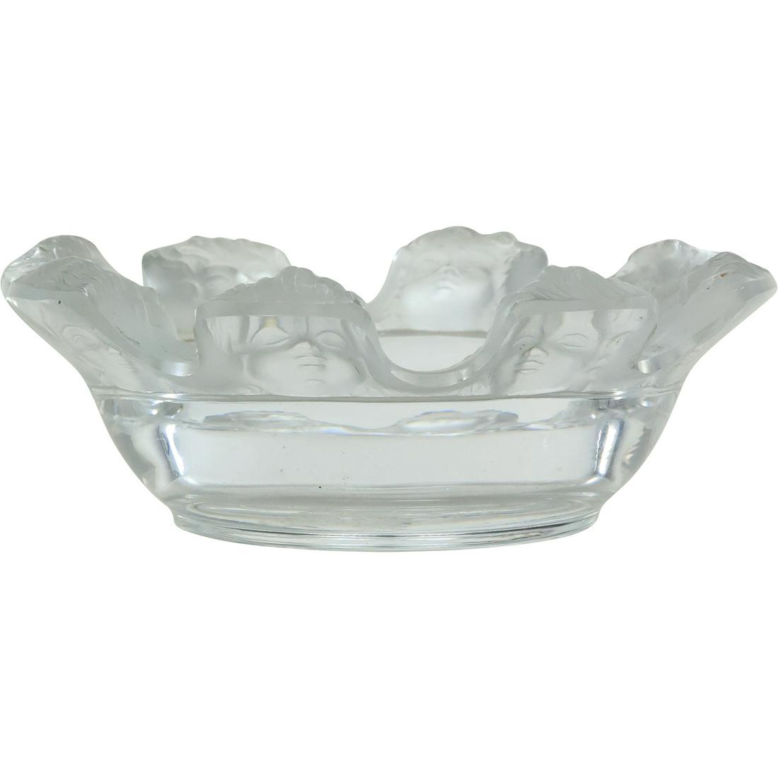 Lalique Crystal St. Nicholas Trinket Dish/Ashtray Embossed Cherub Faces on Rim: Lalique Crystal St. Nicholas Trinket Dish/Ashtray features Adorable Frosted Cherubs on the Rim with Clear Crystal Base size: 1.5 in. x 4.25 in. For more additional photos please 