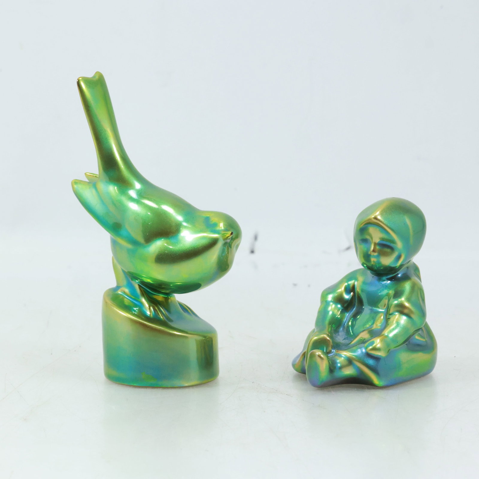 [2] ZSOLNAY Hungary Green Iridescent Pottery "Bird" and "Seated Girl": [2] ZSOLNAY Hungary Green Iridescent Pottery "Bird" 5.25 inches height and "Seated Girl" 3 inches height
