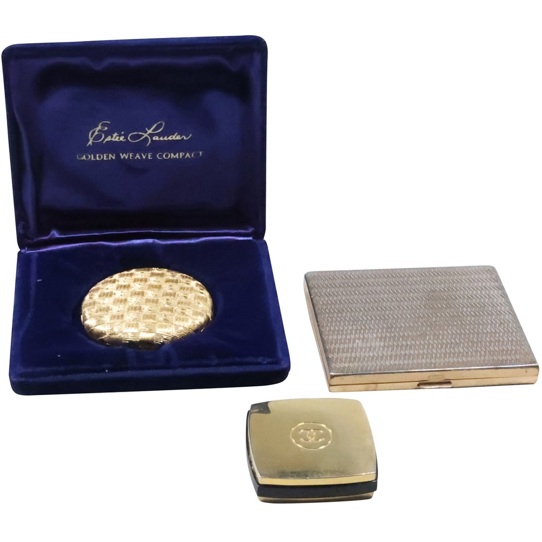 [3] Coco Chanel Compact; Estee Lauder Golden Weave Compact in Case; AGME Switzerland Compact: [3] Coco Chanel Compact 1 5/8 in. x 1 5/8 in.; Estee Lauder Golden Weave Compact 2 in. diameter in Case 4 in. x 3 1/4 in. ; AGME Switzerland Compact gold and enamel 3 1/8 in. x 2 5/8 in.