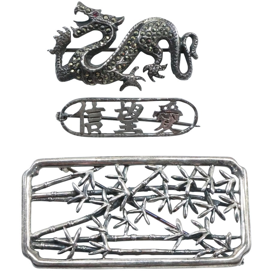3 Assorted Pins: Sterling Silver Oriental Pin, PFM Bamboo Pin, .925 Sterling Marcasites Dragon Pin: 3 Assorted Pins: Sterling Silver Oriental Pin 1 3/8 in. x 3/8 in., PFM Bamboo Pin 2 1/4 in. x 1 1/8 in., .925 Sterling Marcasites Dragon Pin 1 5/8 in. x 7/8 in.