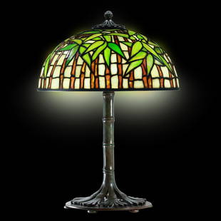 Tiffany Studios New York "Bamboo" Leaded Glass Table Lamp Signed Shade and Base: This exquisite table lamp marked Tiffany Studios New York features the iconic "Bamboo" design in both the leaded glass shade and the bronze base. The shade, signed Tiffany Studios New York #1443, show