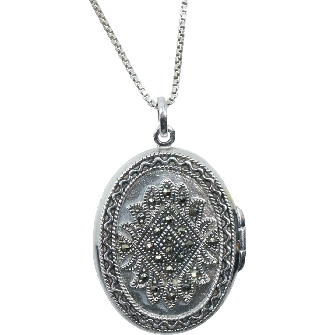 .925 Sterling Silver Marcasite Locket on a 20 in. Sterling .925 Chain: .925 Sterling Silver Marcasite Locket 1 1/2 in. x 1 in. on a 20 in. Sterling .925 Chain.