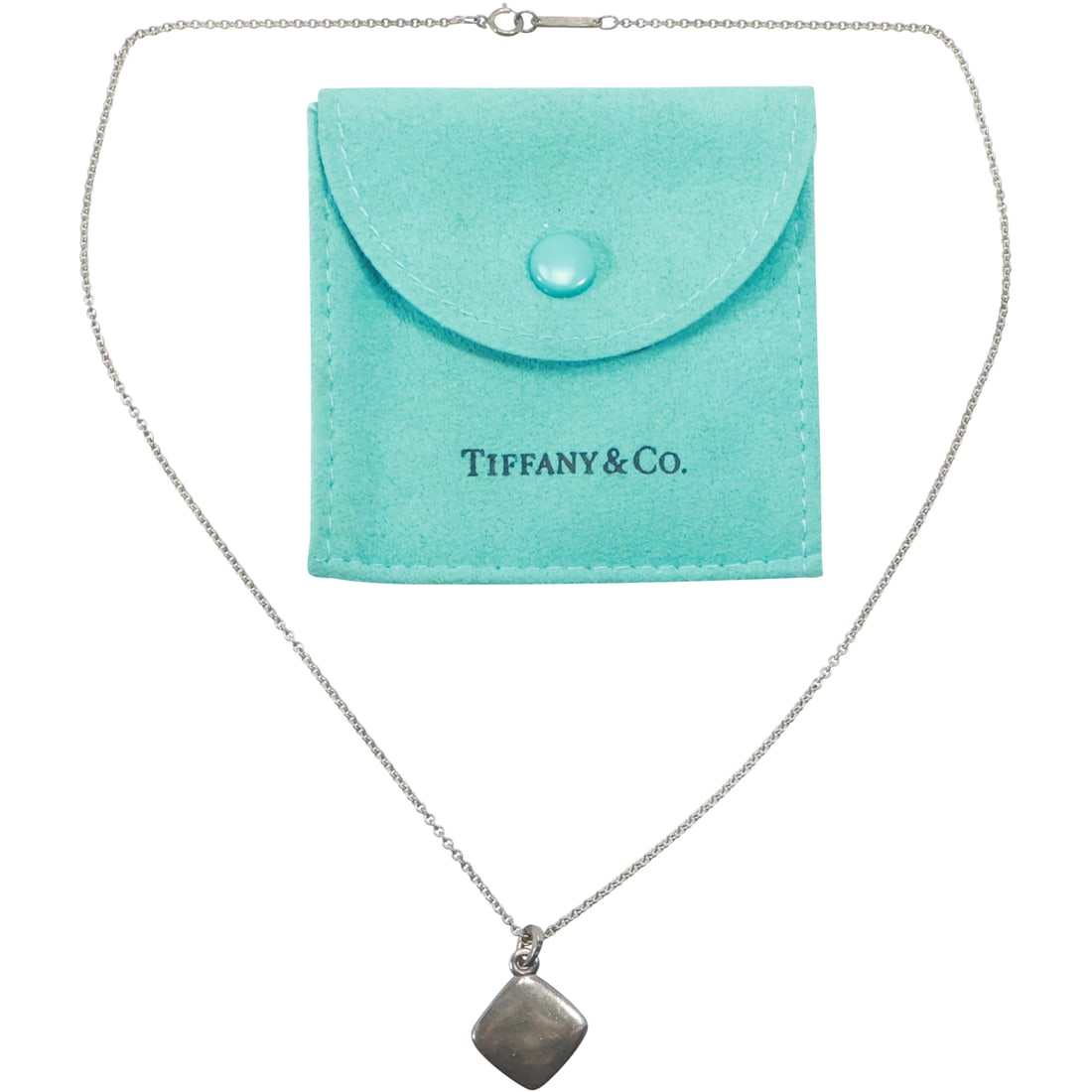 TIFFANY & CO .925 STERLING Silver Charm on TIFFANY & CO .925 Chain 16 in. with Fabric Pouch: TIFFANY & CO .925 STERLING Silver Charm 7/8 in. x 5/8 in. on TIFFANY & CO .925 Chain 16 in. with Fabric Pouch